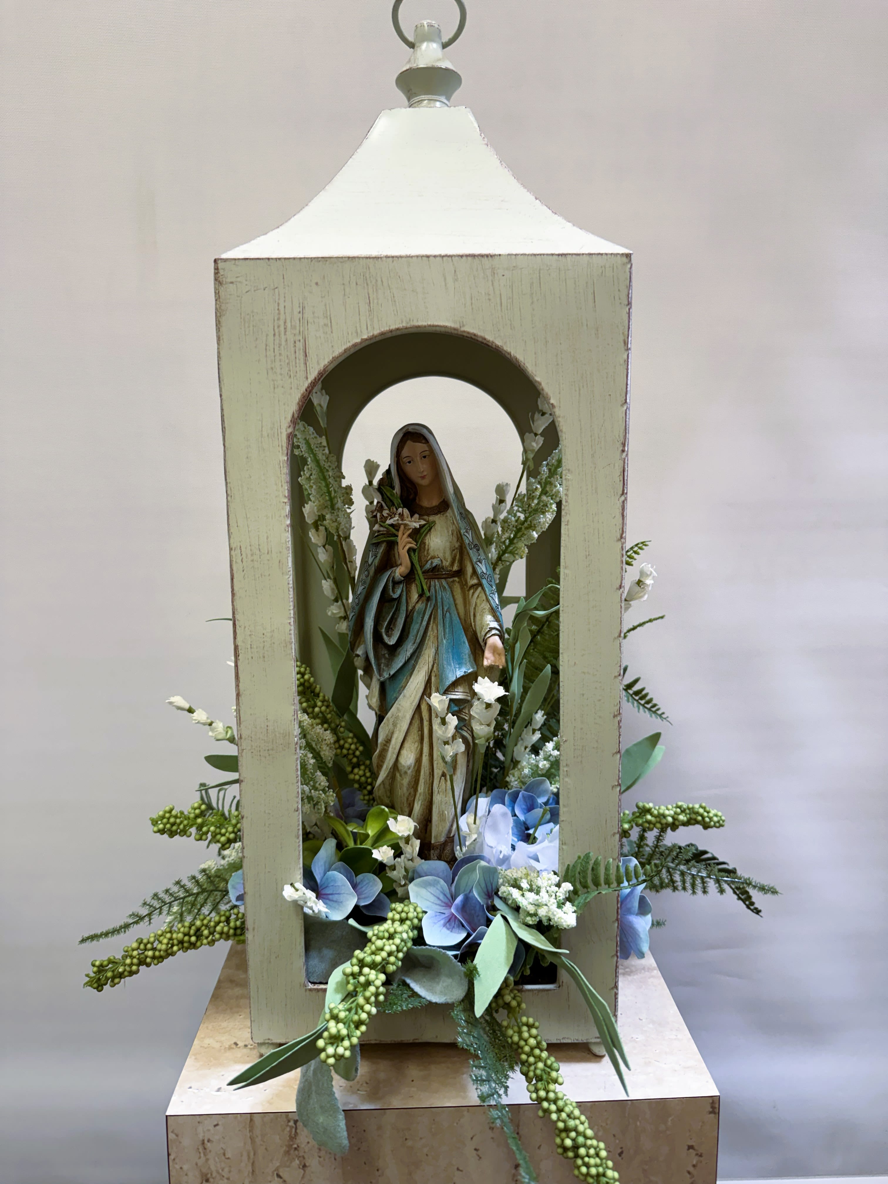 Silk Blessed Mother Tribute  - Features a cream colored lantern with a Virgin Mary statue inside. Flowers featured are silk. 