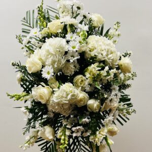 White floral standing spray with roses and daisies