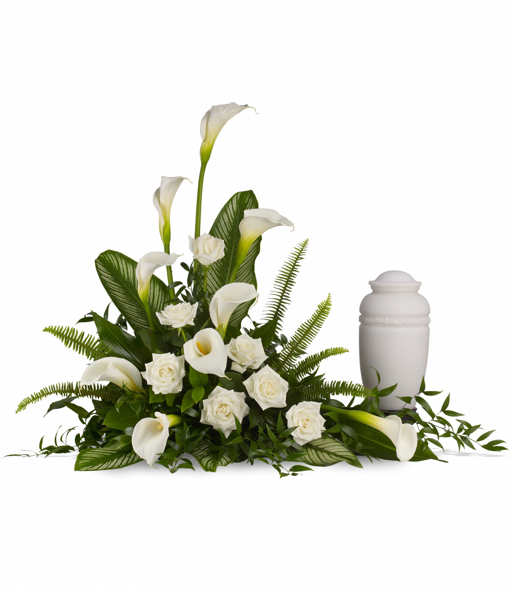 White calla lilies and roses arranged beside a white urn