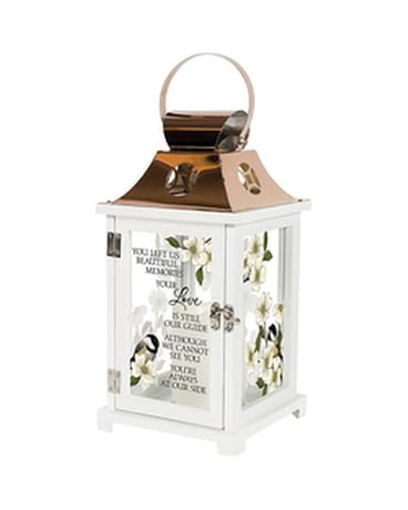 White lantern with floral panels and a memorial quote