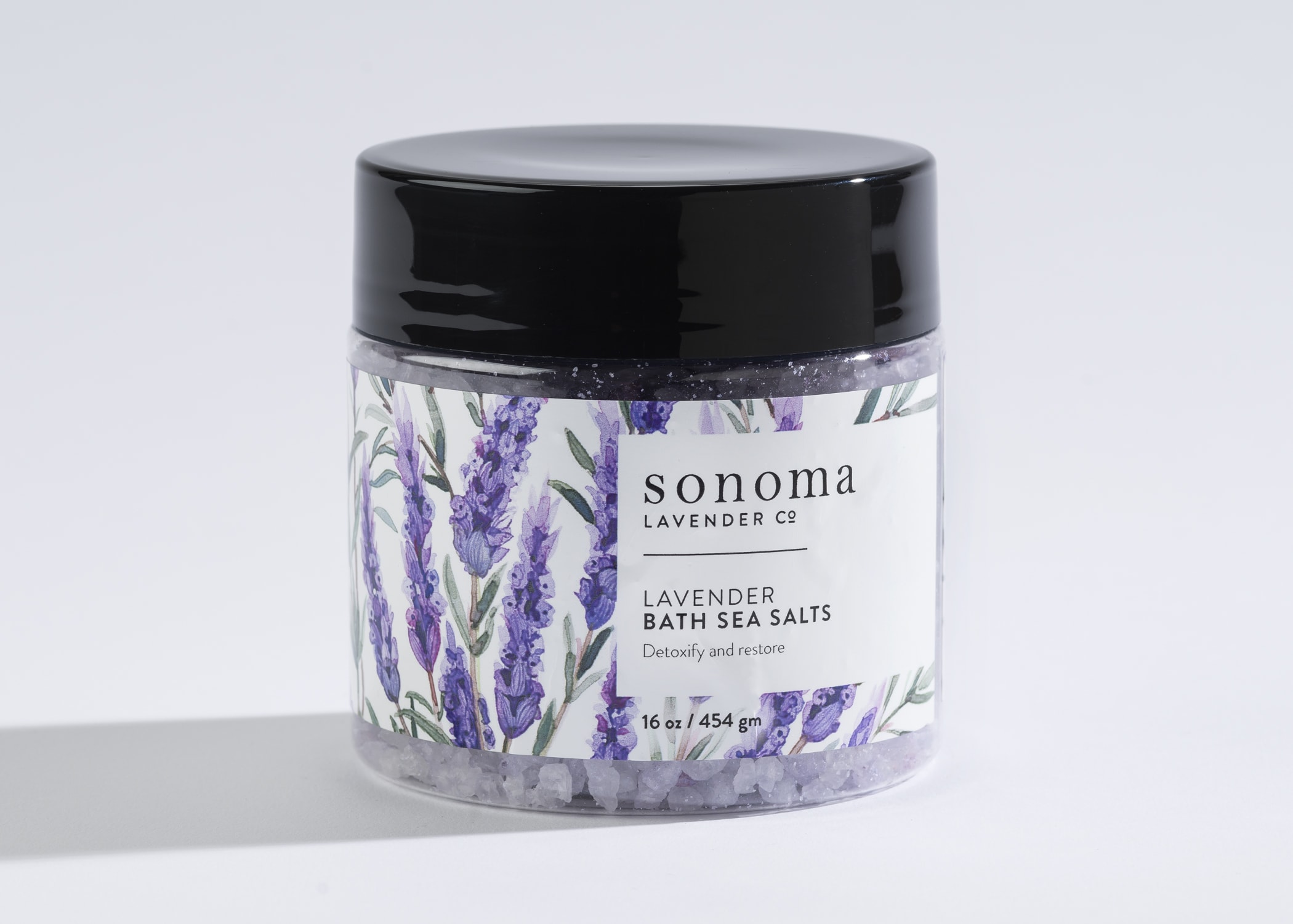 Jar of lavender bath sea salts with illustrated lavender sprigs on the label