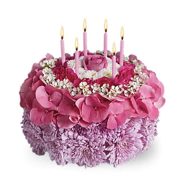 Your Special Day - Tell the birthday girl to make a wish on these candles! Made entirely of fresh flowers, this delightful "cake" will really make her day special. The recipe for this cake includes a pink rose and hydrangea, hot pink miniature carnations, white button spray chrysanthemums and waxflower and lavender cushion spray chrysanthemums. This tasteful arrangement even comes with its own hot pink candles. It's everything a girl could wish for!   Orientation : All-Around  All prices in USD ($)  Standard  T16-3A  Deluxe  T16-3B  Premium  T16-3C