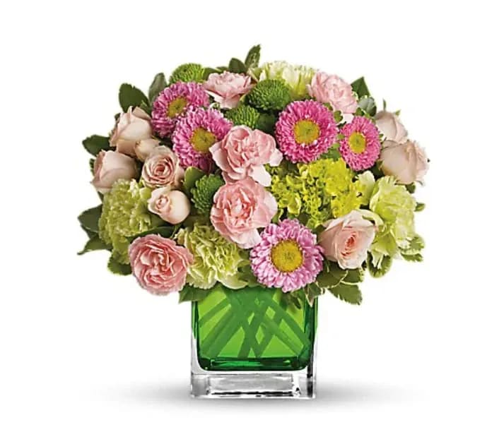 Make Her Day - Sweetly sophisticated, this arrangement of green miniature hydrangea and light pink spray roses presented in our citrus green glass cube is the perfect gift. Includes green miniature hydrangea, light pink spray roses, green carnations, pink miniature carnations, pink matsumoto asters and green button spray chrysanthemums accented with assorted greens. Delivered in Teleflora's glass citrus cube. 