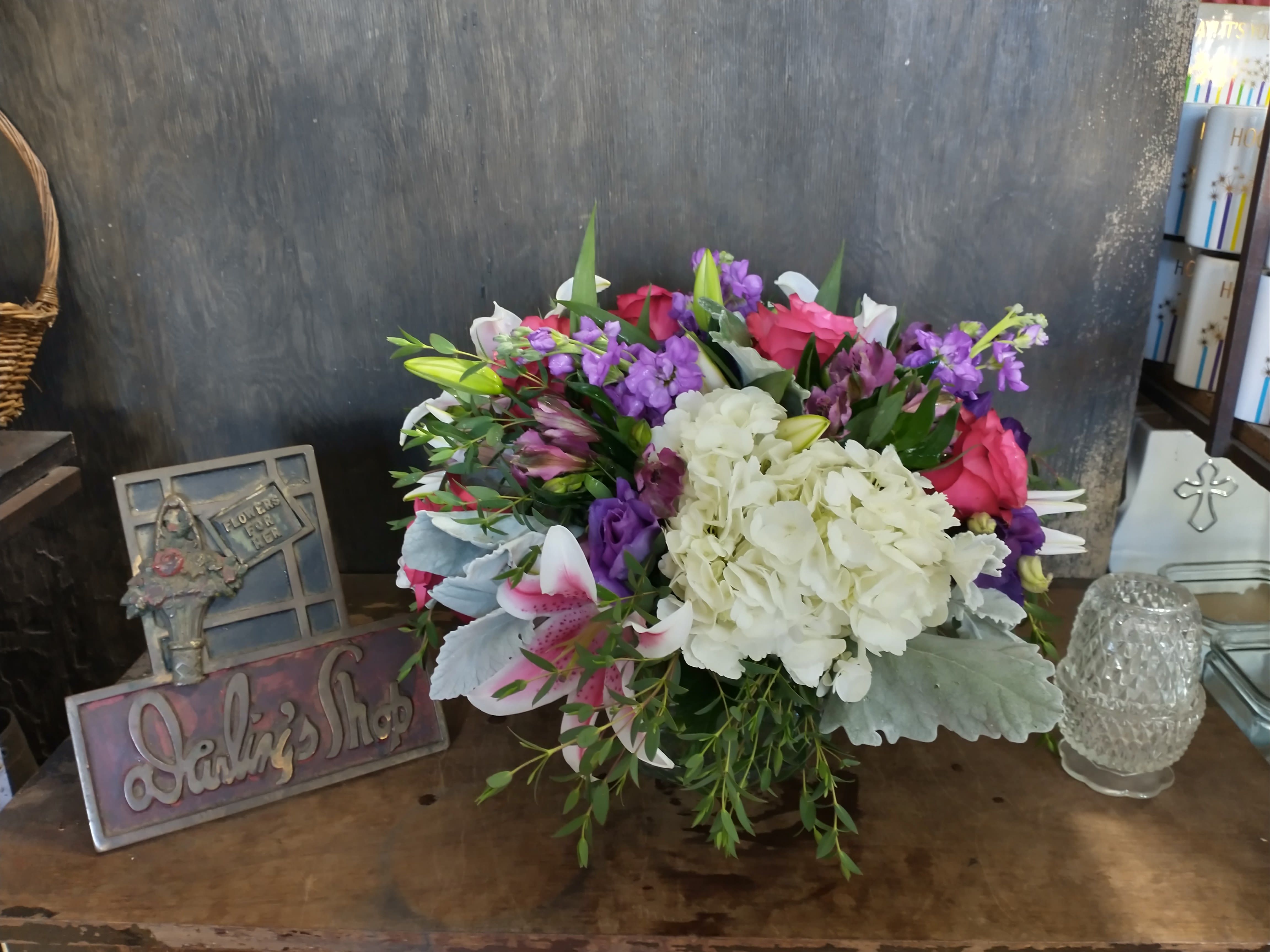 Mixed bouquet with white hydrangea, pink roses, and purple flowers