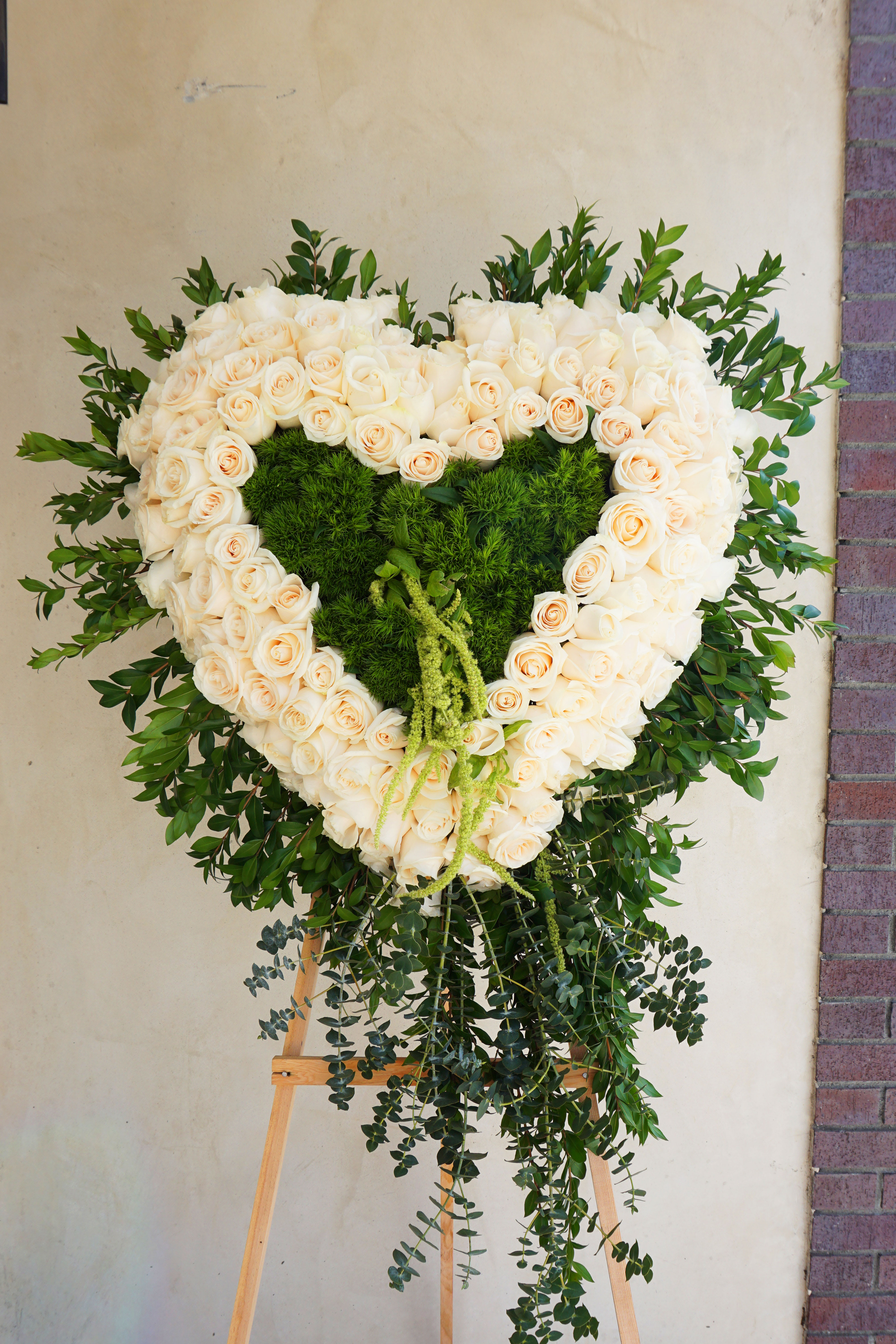 Majestic Heart  - Beautiful tall standing spray. The standing isle is included. Delivery includes setup.  