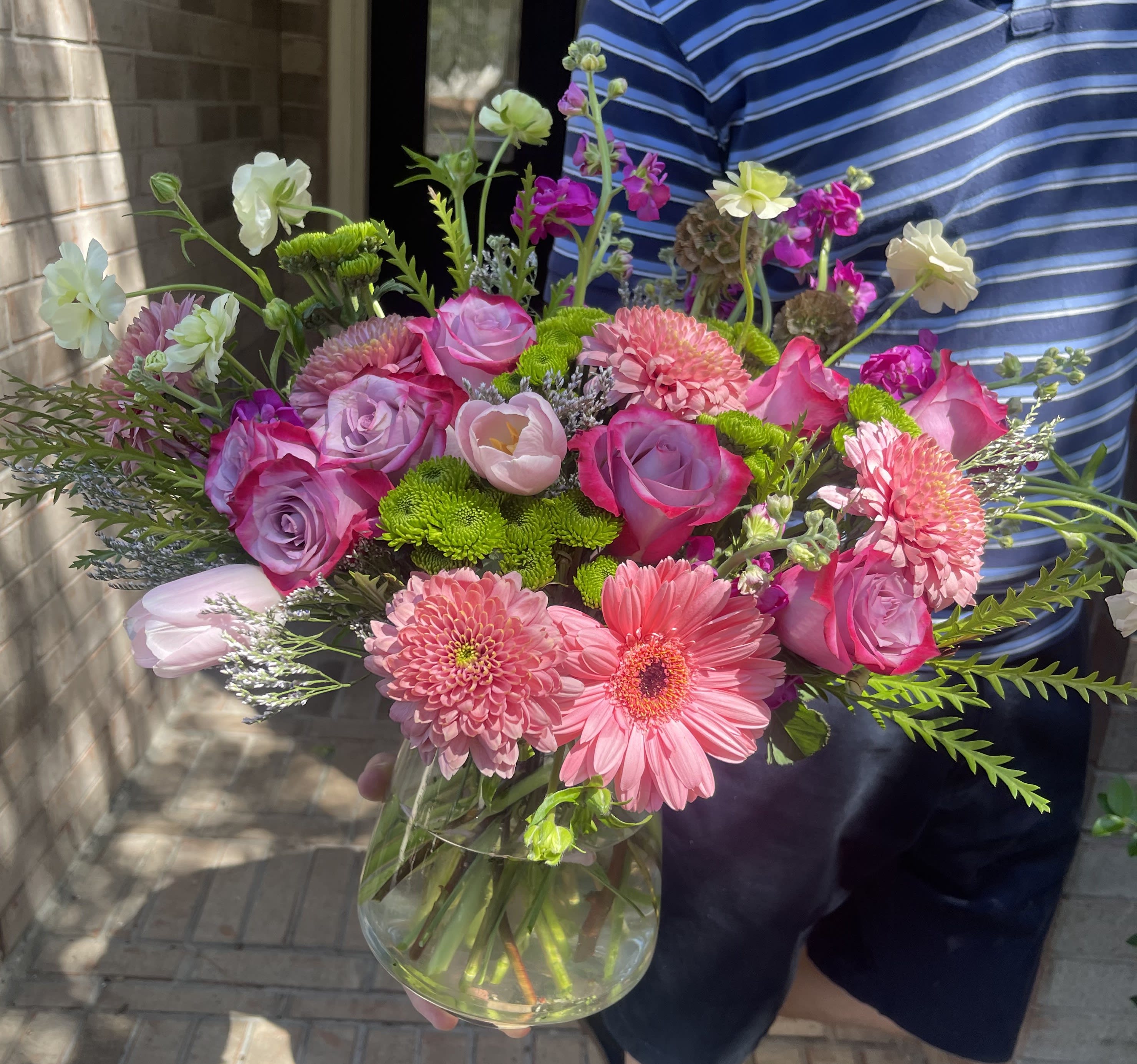 Pink and lavender mixed bouquet in a clear glass vase