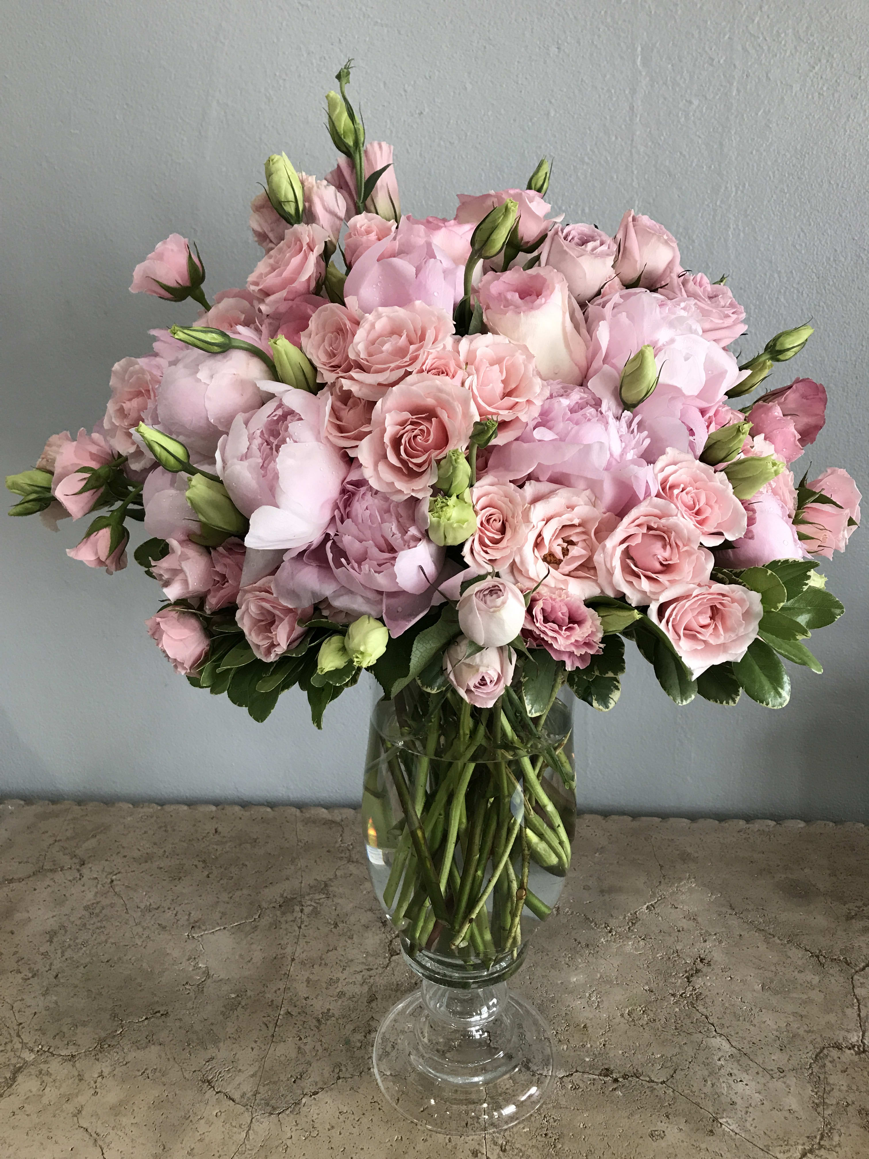 Pink rose bouquet in a clear glass vase