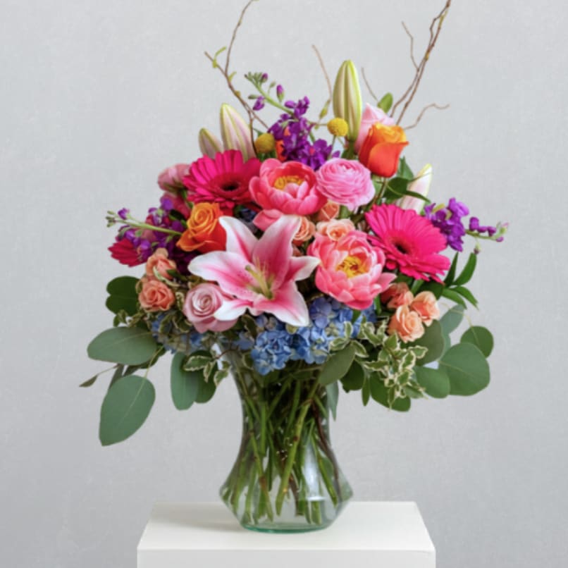 Garden Splendor Bouquet - EVERYDAY COLLECTION | LOCAL DELIVERY ONLY  Go all out with "Garden Splendor" - A showstopper designed in a grand vase, this arrangement is overflowing with hydrangea, peonies, stock, gerbera daisies, roses, lilies, billy balls, curly willow and premium greenery. 
