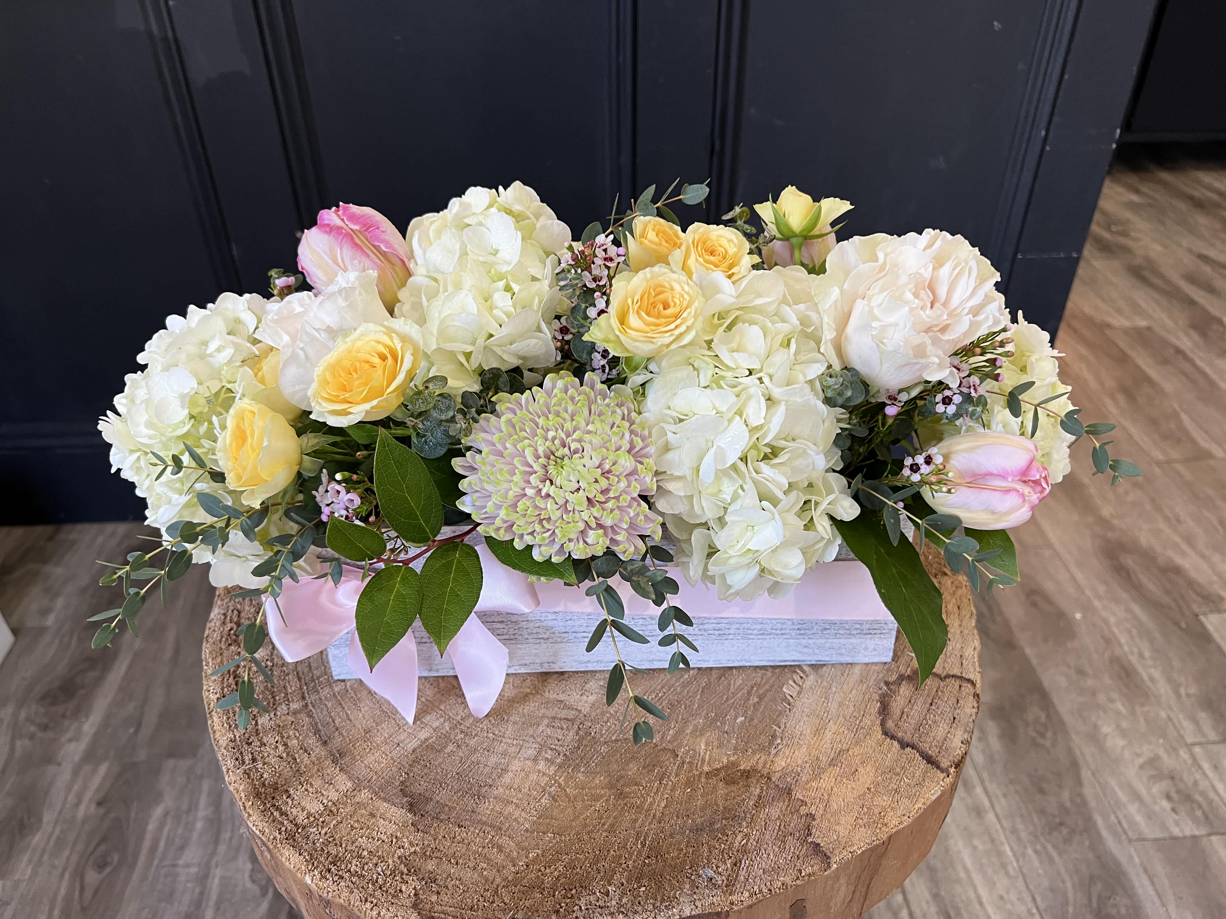 Cotton Candy - White and soft yellow roses with a variety of greenery and eucalyptus come together for a lovely arrangement. A stylish and sweet way to dress up any space.  Delivery minimum is $50.00 Our DELIVERY SERVICE IS TILL 3 PM We cannot guarantee requests for a specific time of delivery. There might be flower substitutions, due to low supply of certain flowers. However, we do our best to provide you with the same look and feel of the arrangement. Our main goal is to always give our customers quality flowers and service. To make sure that you get the exact same flowers, ordering a few days ahead of desired delivery date is key. 