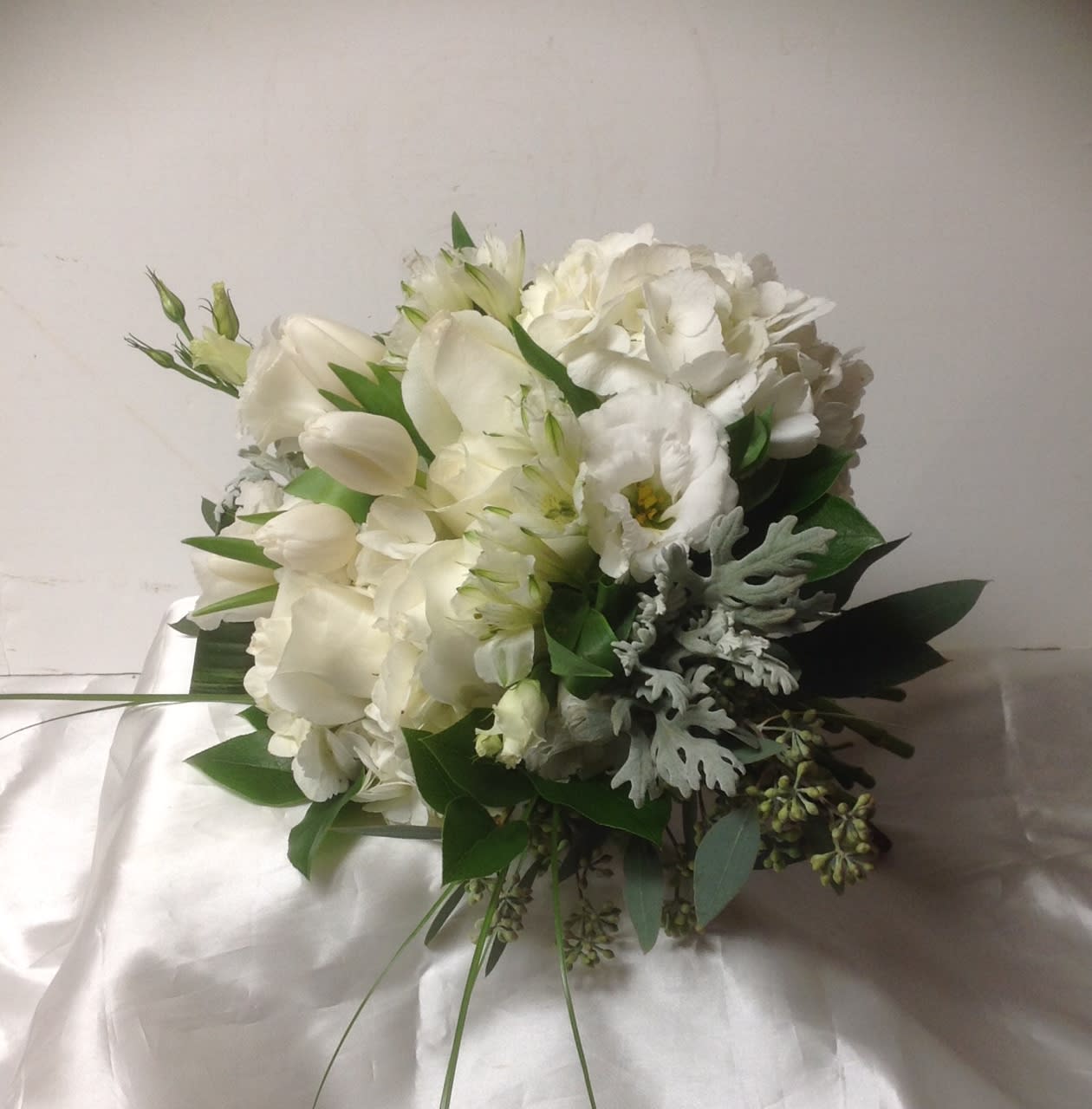 White bouquet with tulips and hydrangea-like blooms