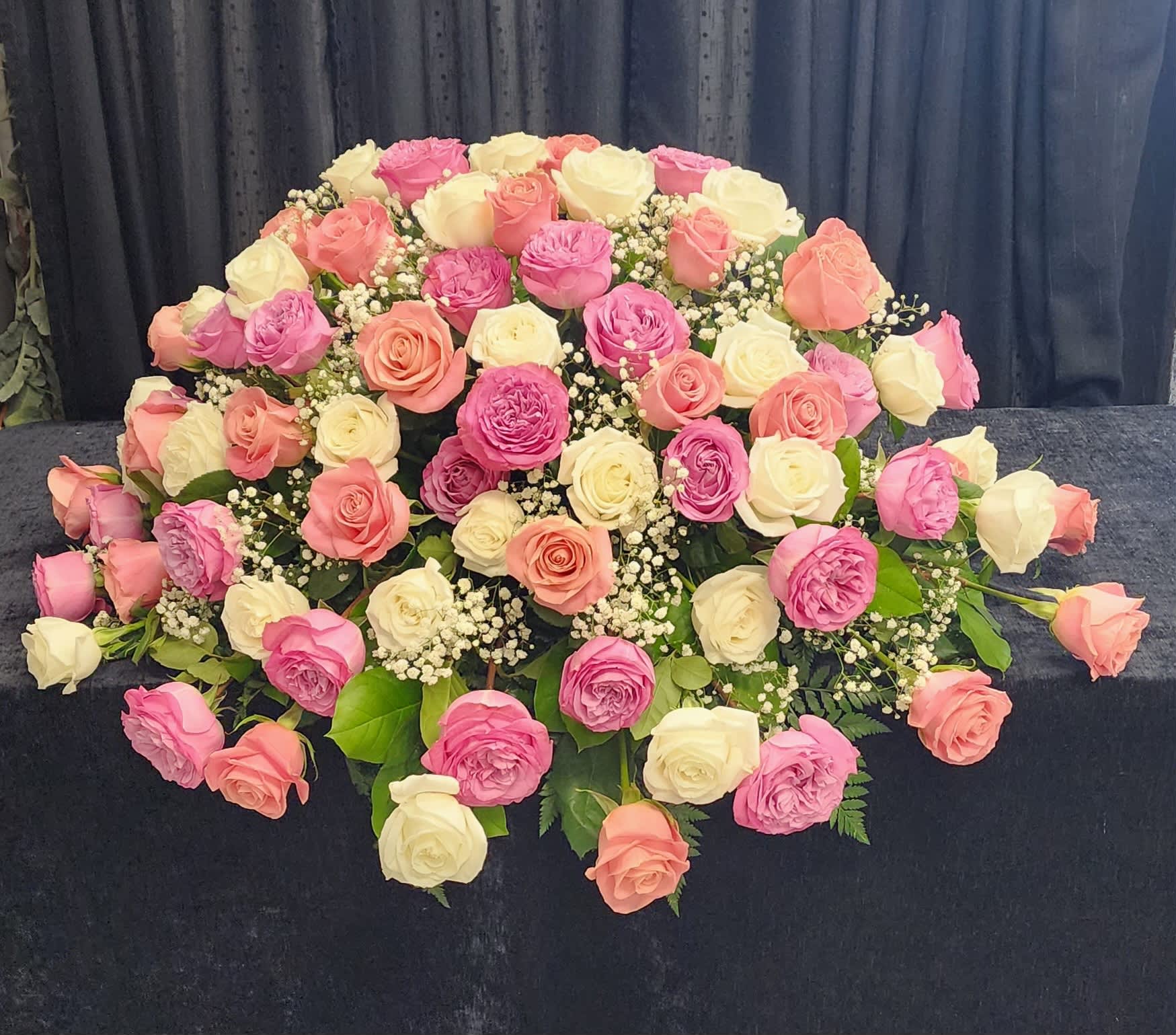 Large bouquet of pink, peach, and white roses
