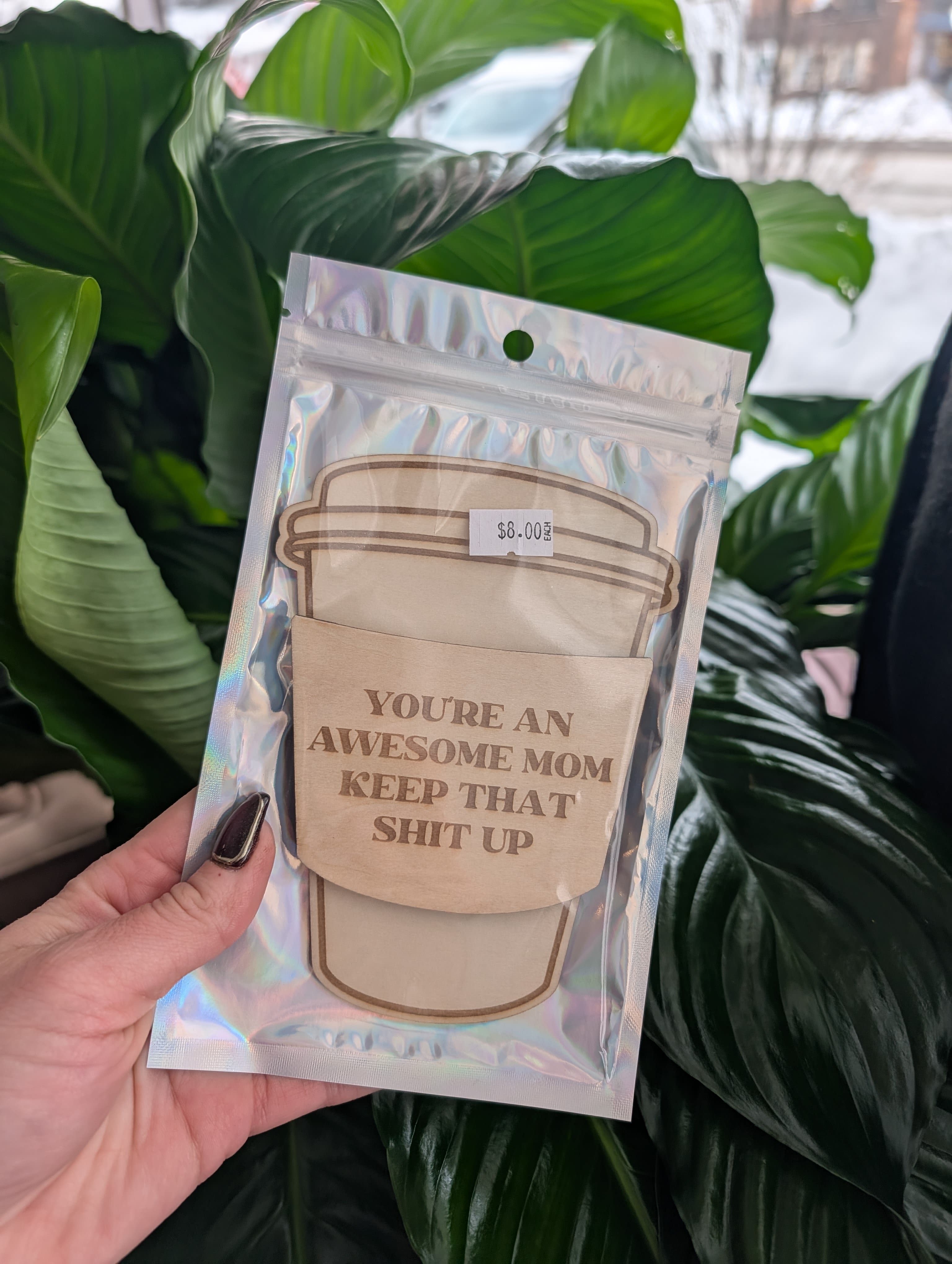 Packaged greeting card with a coffee cup design and bold text