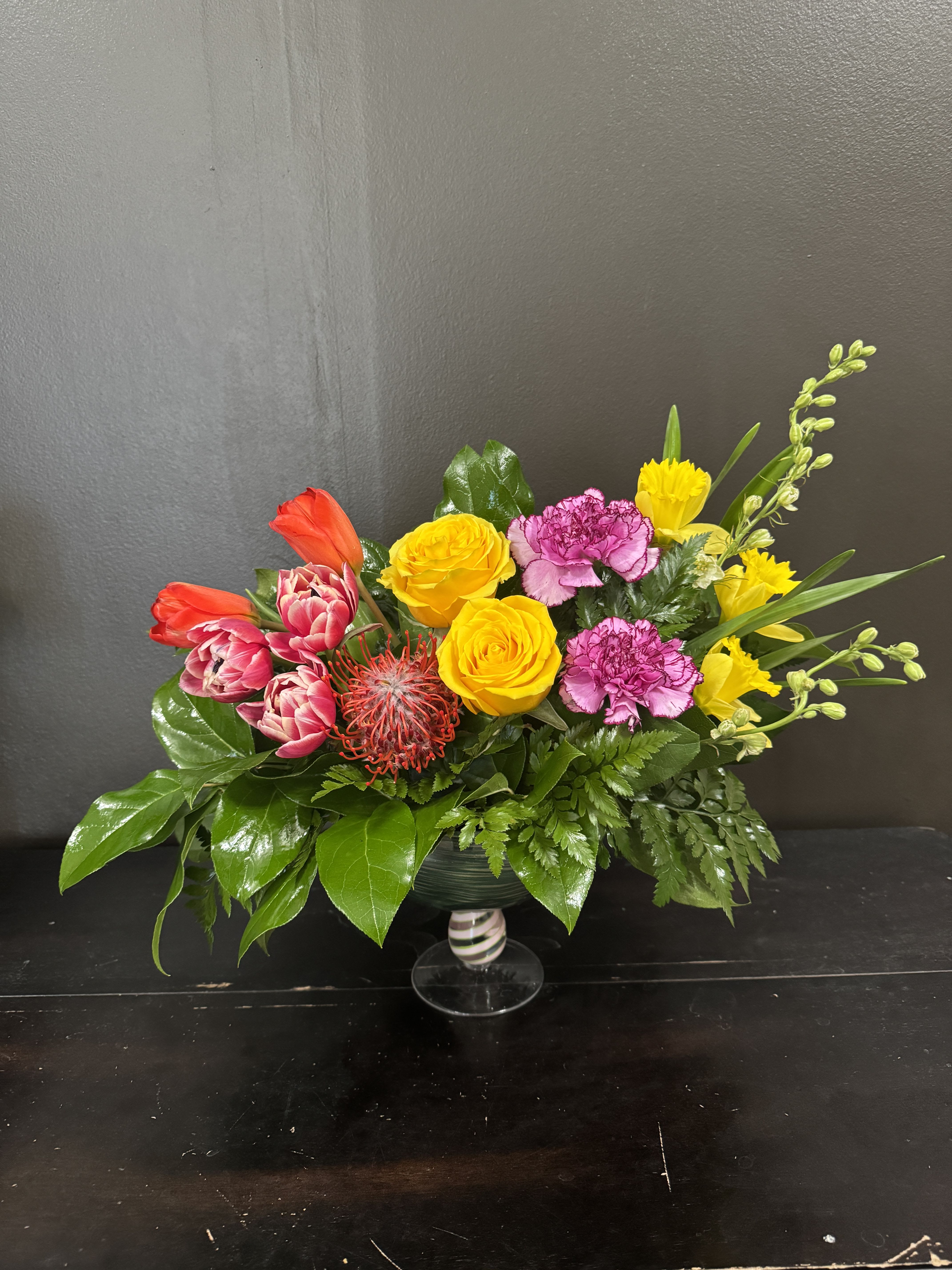 Bahama Mama - A tropical style arrangement in a unique bowl style pedestal vase.  