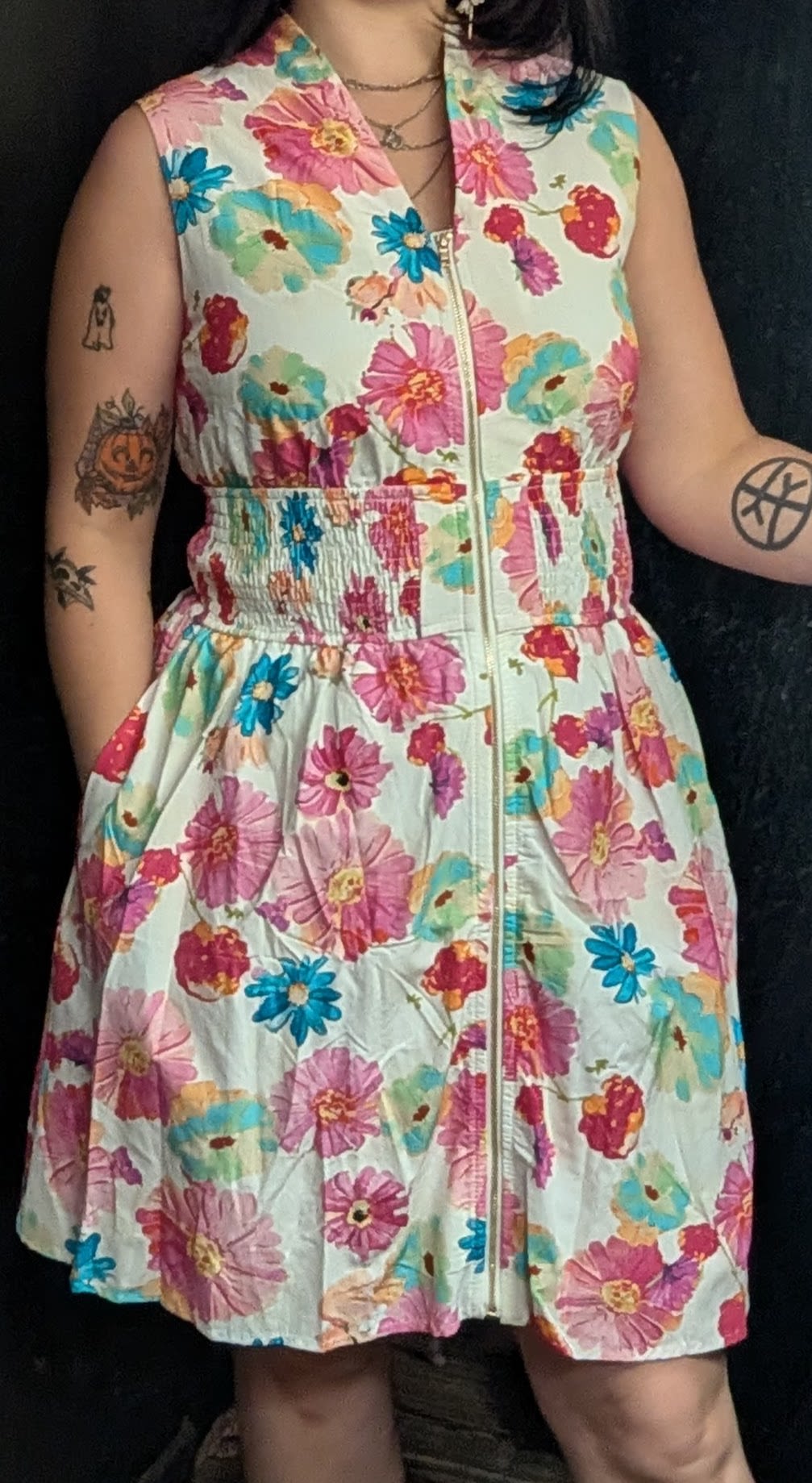 Cotton Floral Dress  - Floral sleeveless dress with a zip front and pockets. Available in sizes S,M,L.