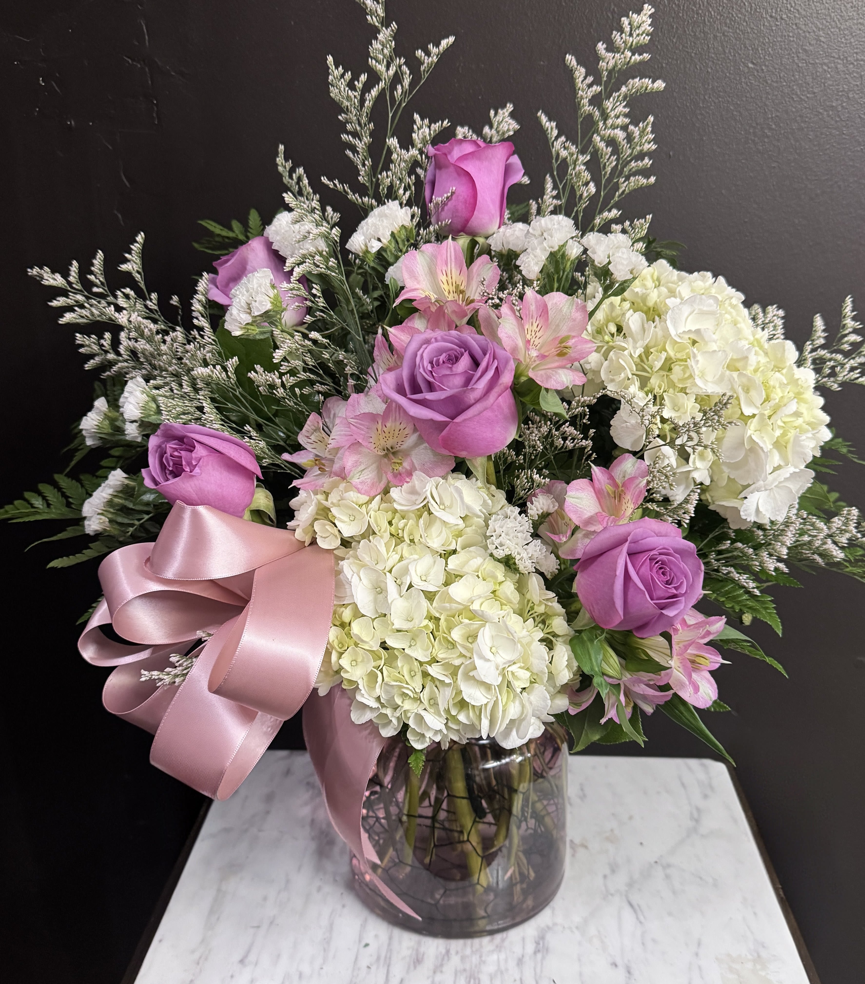 Lilac Luster - Lavender and white in a clear glass vase.