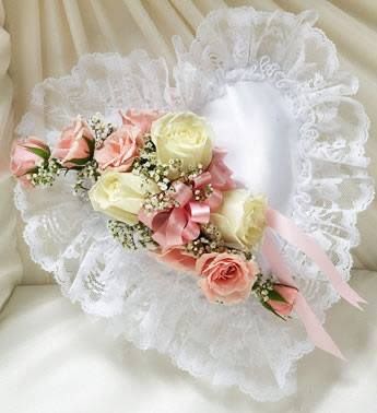 White lace bouquet with pink and cream roses and ribbon