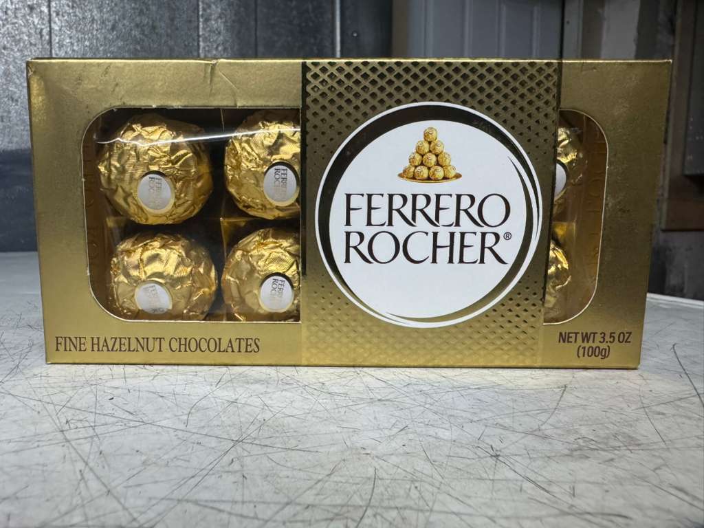 Box of Ferrero Rocher chocolates in gold wrappers
