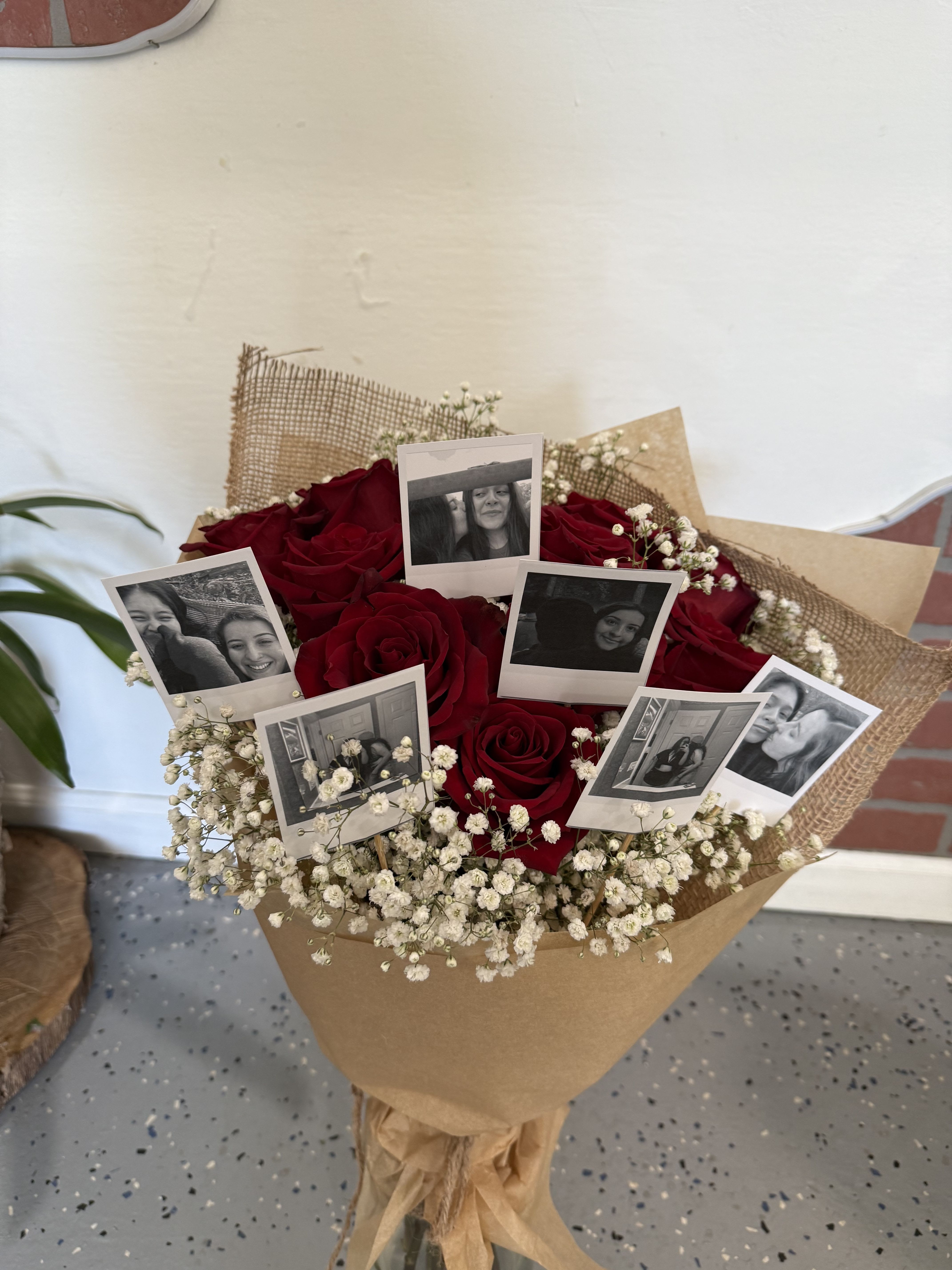 Bouquet of red roses with baby’s breath and photo prints