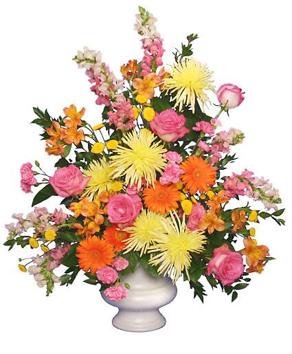 Twilight Serenity - Acrylic Urn Container,  foliage: Huckleberry, Salal,   Yellow Spider Fuji Mums,   Orange Gerberas,   Pink Roses,   Pink Snapdragons,   Pink Variegated Mini Carnations,   Yellow Button Pompons,   Orange &amp; Yellow Alstroemeria.