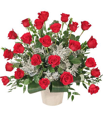 Dearest Departure - Celebrate the life of a lost loved one with a classy sympathy arrangement that features vibrant red roses that stand tall against luscious greenery. The Dearest Departure sympathy arrangement would be a perfect gift to relay your deepest condolences during this time of loss.  Includes J Mach Container, Foliage: Aspidistra, Ruscus, Myrtle, Dusty Miller, Red Roses.
