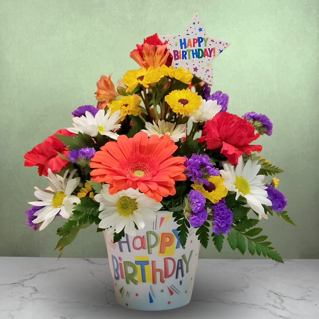 Birthday Brights - The Birthday Brights by Savilles Country Florist is a burst of Birthday goodness with fun bright colors presented in a colorful "Happy Birthday" container and accented with a Birthday pick.  A wonderful gift idea that is sure to bring a smile!  Approx. 12" H x 10" W