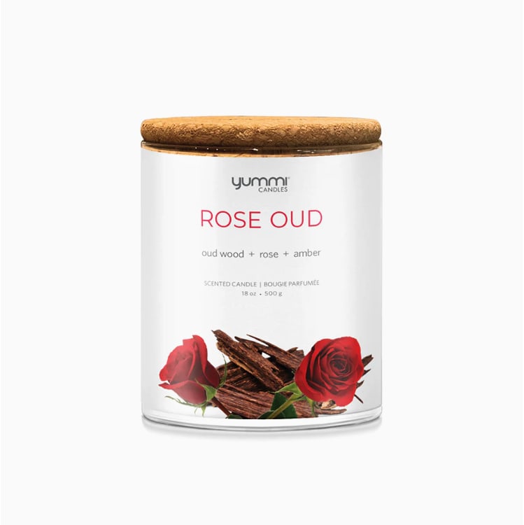 Rose oud scented candle in a glass jar with a wooden lid
