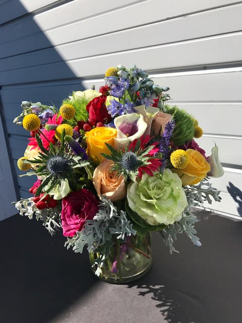 Colorful mixed bouquet in a clear glass vase
