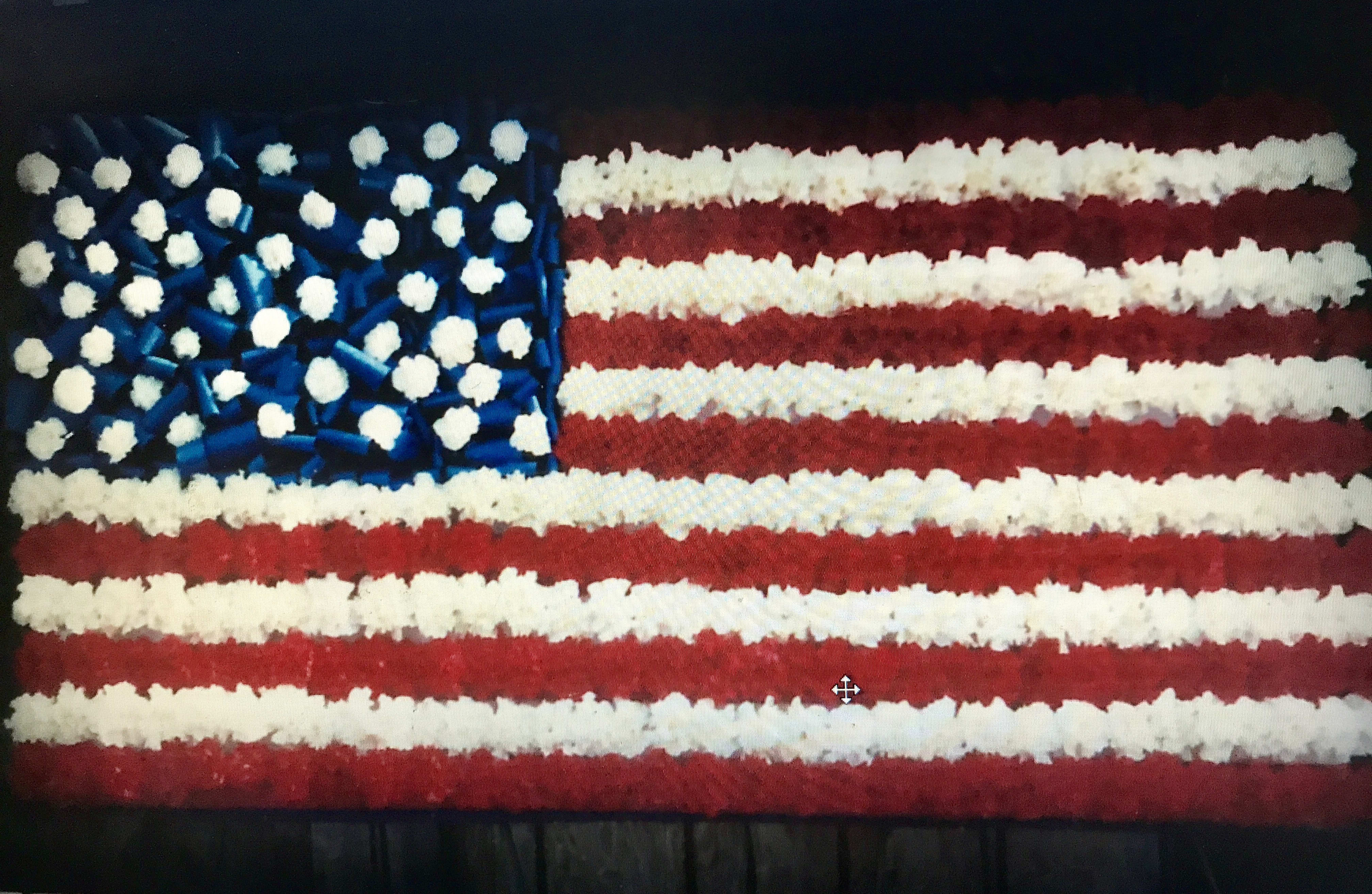 Floral arrangement shaped like the American flag in red, white, and blue