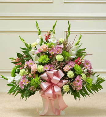 Heartfelt Tribute Pastel Floor Basket Arrangement - Product ID: 91399   When youâre trying to find a way to express your deepest sympathy, this pastel sympathy floor basket helps you beautifully say what is in your heart. Our expert florists use only the freshest blooms, including pastel roses, gladiolas, snapdragons and more, to show your love and concern for family, friends and colleagues during a difficult time. Floor basket arrangement of fresh pastel roses, gladiolas, snapdragons, mums, carnations, daisy poms, heather and more Appropriate for family, friends or business associates to send directly to the funeral home Our florists use only the freshest flowers available, so colors and varieties may vary Large arrangement measures approximately 32"H x 40"L Medium arrangement measures approximately 32"H x 38"L Small arrangement measures approximately 32"H x 32"L