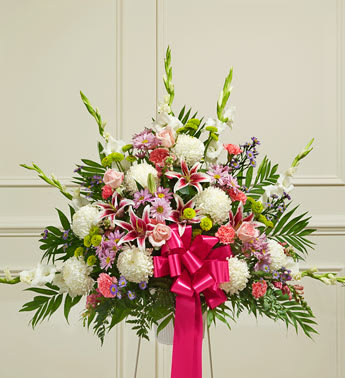 Heartfelt Sympathies Pastel Standing Basket - Product ID: 91407   Your heart is filled with sympathy, love and remembrance. This touching tribute is a beautiful way to help you express your feelings during this difficult time. Our expert florists handcraft a standing basket from soothing and delicate pastel blooms to create a heartfelt final memorial for someone who has passed, and an unforgettable show of support for those they have left behind. Standing basket arrangement of fresh pastel roses, lilies, mums, gladiolas, snapdragons, carnations, poms and more Appropriate for family, friends or business associates to send directly to the funeral home Our florists use only the freshest flowers available, so colors and varieties may vary Large measures approximately 38"H x 38"L without stand Medium measures approximately 32"H x 36"L without stand Small measures approximately 30"H x 34"L without stand Stand may not be available in all areas