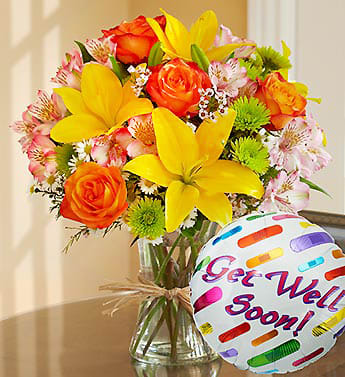 Fields of Europe Get Well - Product ID: 90978  Just what the doctor ordered -- inspired by the spectrum of color found in the rolling fields of Europe, our florists designed this gathering of fresh roses, lilies, alstroemeria, poms and more inside a stylish clear glass vase tied with raffia, as a nod to rustic European style. Includes a "Get Well" 18"D Mylar balloon. Gorgeous gathering of roses, lilies, alstroemeria, poms, waxflower, monte casino and salal Artistically designed by our select florists in a clear glass gathering vase tied with raffia; vase measures 8"H Paired with a 18"D Mylar "Get Well" balloon; design on balloon will vary due to local availability Large arrangement measures approximately 20"H x 16"W Medium arrangement measures approximately 18"H x 15"W Small arrangement measures approximately 16"H x 14"W Our florists hand-design each arrangement, so colors, varieties, and container may vary due to local availability Lilies may arrive in bud form and will open to full beauty over the next 2-3 days