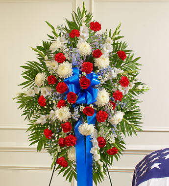 Deepest Red, White &amp; Blue Standing Spray - Product ID: 91292   Honor a beloved veteran for their dedicated service with this heartfelt patriotic arrangement. Meticulously crafted by our expert florists using the freshest red, white and blue blooms, it perfectly conveys all the love, pride and sympathy you feel in your heart. Standing spray arrangement of fresh red, white and blue flowers such as roses, football mums, gladiolas, delphiniums, carnations and more Appropriate for family, friends and business associates to send directly to the funeral home Our florists use only the freshest flowers available, so colors and varieties may vary Measures approximately 34"H x 40"L without easel