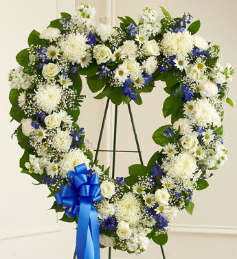 Always Remember Blue &amp; White Floral Heart Tribute - Product ID: 91239  Let their special memories live on forever while expressing your deepest sympathy. This striking, heart-shaped tribute is crafted by our expert florists from fresh, beautiful blue and white blooms to help you offer your comfort and support during a difficult time. Heart-shaped arrangement of fresh blue and white flowers such as roses, delphinium, carnations and more Comes on a wire easel with accents and satin ribbon Appropriate for family or friends to send directly to the funeral home Our florists use only the freshest flowers available, so colors and varieties may vary Measures approximately 28"H x 28"L without easel