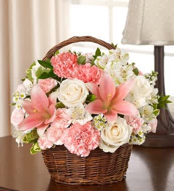 Peace, Prayers &amp; Blessings - Pink and White - Product ID: 95395  Fill their memories of lost loved ones with the peace and serenity of our graceful basket arrangement. Beautifully hand-designed by our florists with elegant white roses, pink lilies, pink carnations and pink alstroemeria. Peaceful pink and white arrangement of roses, lilies, alstroemeria, carnations, mini carnations and monte casino, accented with variegated pittosporum and myrtle Hand-arranged in a willow handled basket; measures 8"H Appropriate to send to the home of friends and family members or to the memorial service Large arrangement measures approximately 12"H x 12"L Medium arrangement measures approximately 11"H x 11"L Small arrangement measures approximately 10"H X 10"L Our florists hand-design each arrangement, so colors, varieties, and basket may vary due to local availability Lilies may arrive in bud form and will open to full beauty over the next 2-3 days