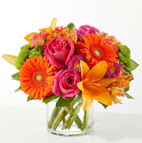 Summer Soiree - As glamorous and colorful as a seasonal soiree, these blooms bring positive energy and décor into your recipient's space.  Details: The Standard Bouquet is approximately 9"H x 12"W. Designed by florists, ready to display. For long–lasting blooms, replace the water daily. We suggest trimming the stems every couple days. Pet Safety Precautions: This bouquet or plant may include flowers and foliage that are known to be toxic to pets. To keep them safe, be sure to keep this arrangement out of your pet's reach. Bloom Details: Rose, Alstroemeria, Gerbera Daisy, Lily, Aster, Carnation