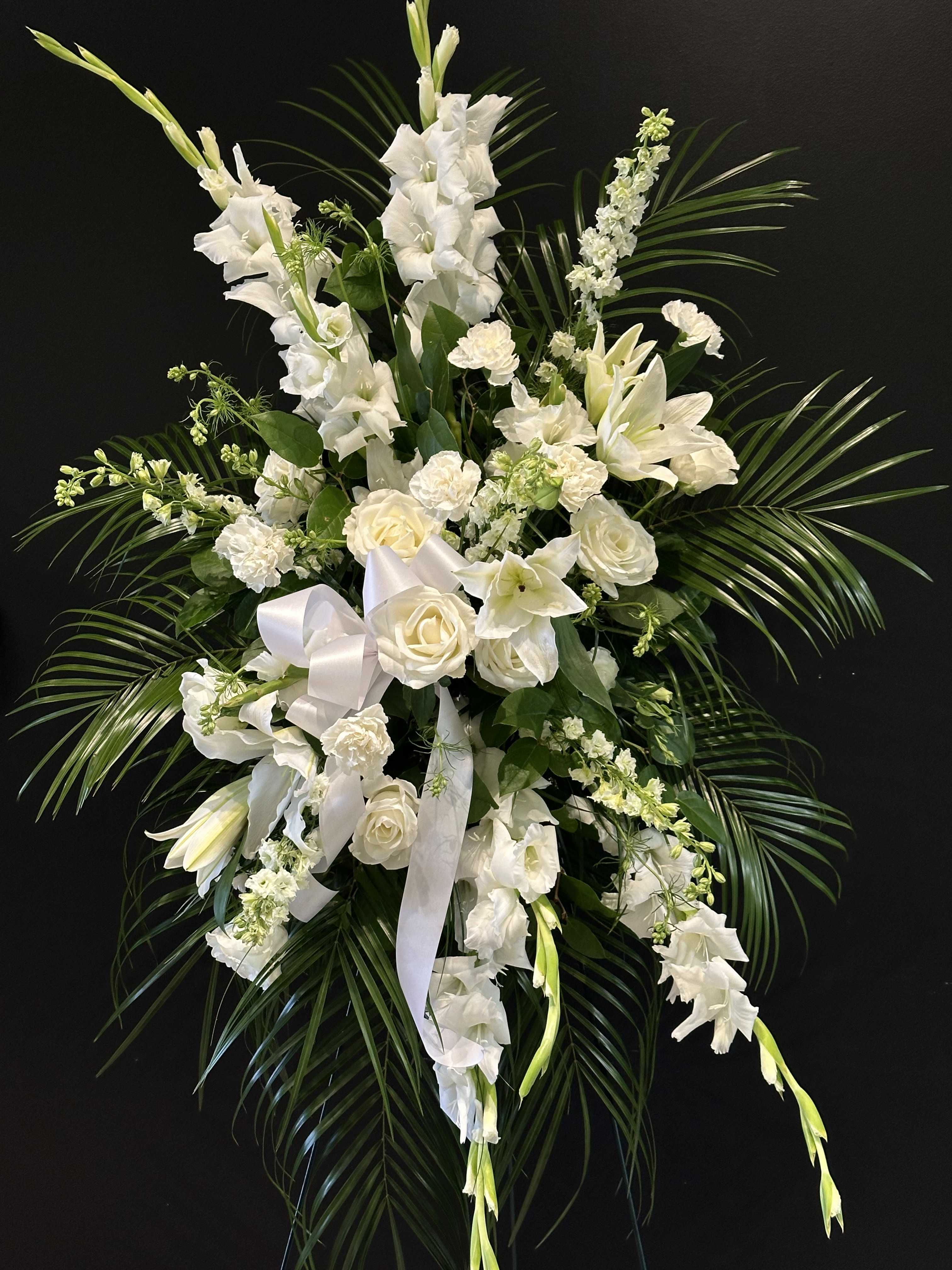 Pure White - An all white elegant standing spray.  *Flowers subject to change based on supply, flowers of equal or greater value will be substituted*