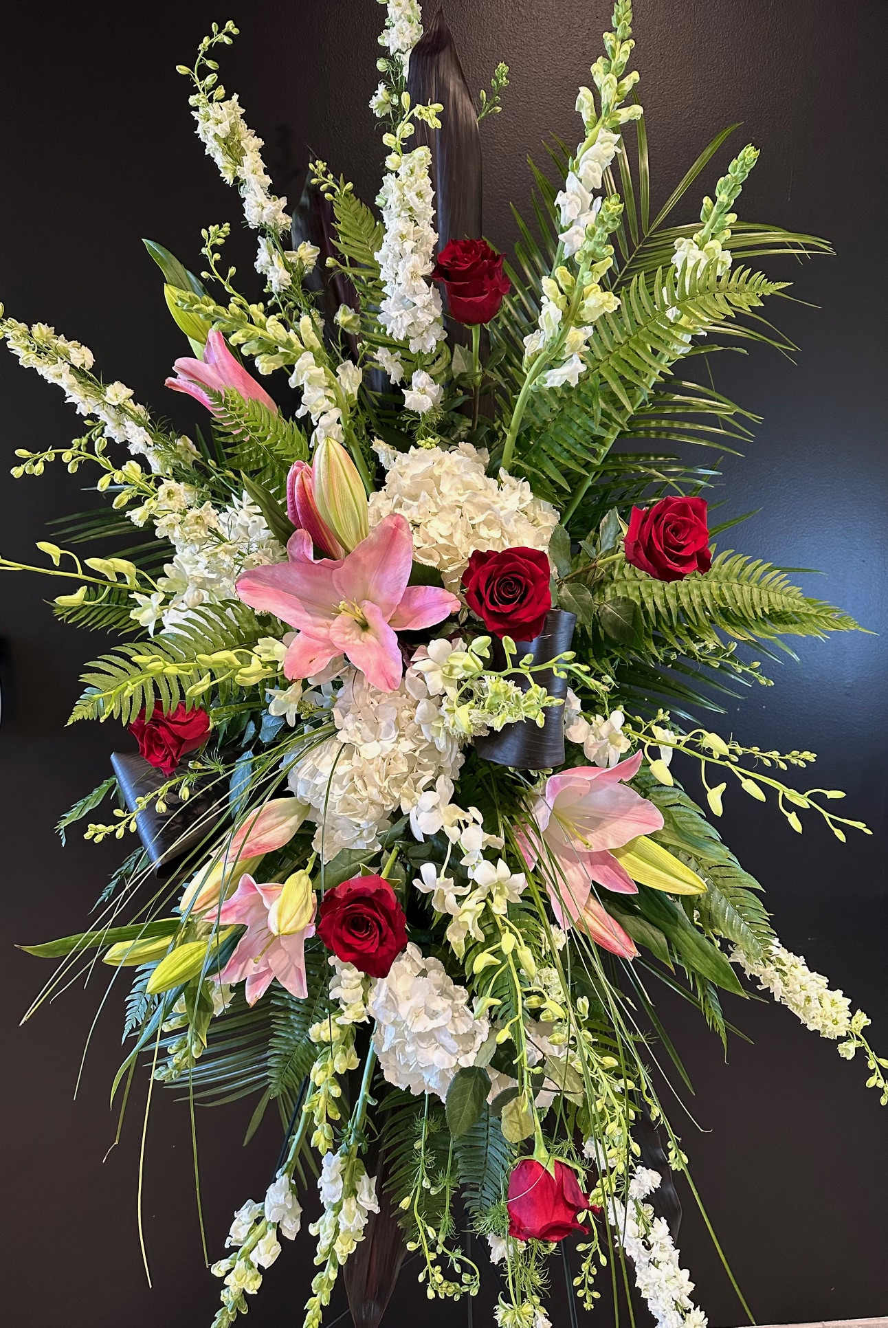 Memories Standing Spray - A thoughtful and memorie filled standing spray in shades of pinks, reds, and whites.    * Flowers are subject to change based on supply*