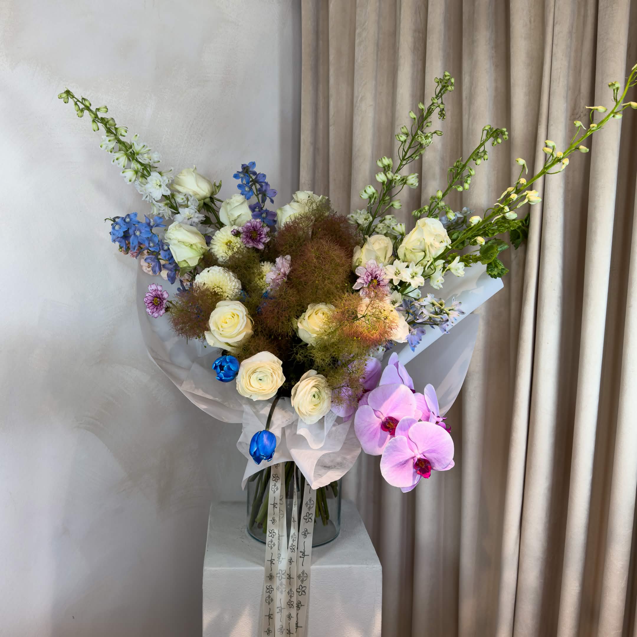 Daehwa Maeum DC Bouquet  - Maeum (마음) - a bouquet guided by feeling and intuition.  - Each arrangement is designed without a fixed formula, allowing the season and materials to shape the final form. - No two bouquets are the same. - Wrapped in our signature Korean-style presentation for a modern, minimal finish.  What’s Included: - Fresh seasonal flowers - Handwritten note + care instructions - Carry-out bag - Water source to keep stems fresh - Bouquets with 18+ stems include a water pouch for transport  Please Note:  - Bouquets do not include a vase. - Images are for inspiration only - each piece is one of a kind and not replicated.  Delivery:  - Next-day delivery is available and works perfectly for most orders. - Orders are best placed 2–3 days in advance. - For same-day or weekend delivery, call or text 704.975.2774 to confirm availability.  FINAL SALE POLICY: All orders are final sale. Due to the custom and perishable nature of our floral designs, we are unable to accommodate cancellations, refunds, or exchanges once an order has been placed. Each arrangement is made uniquely for you, with care and attention to detail.
