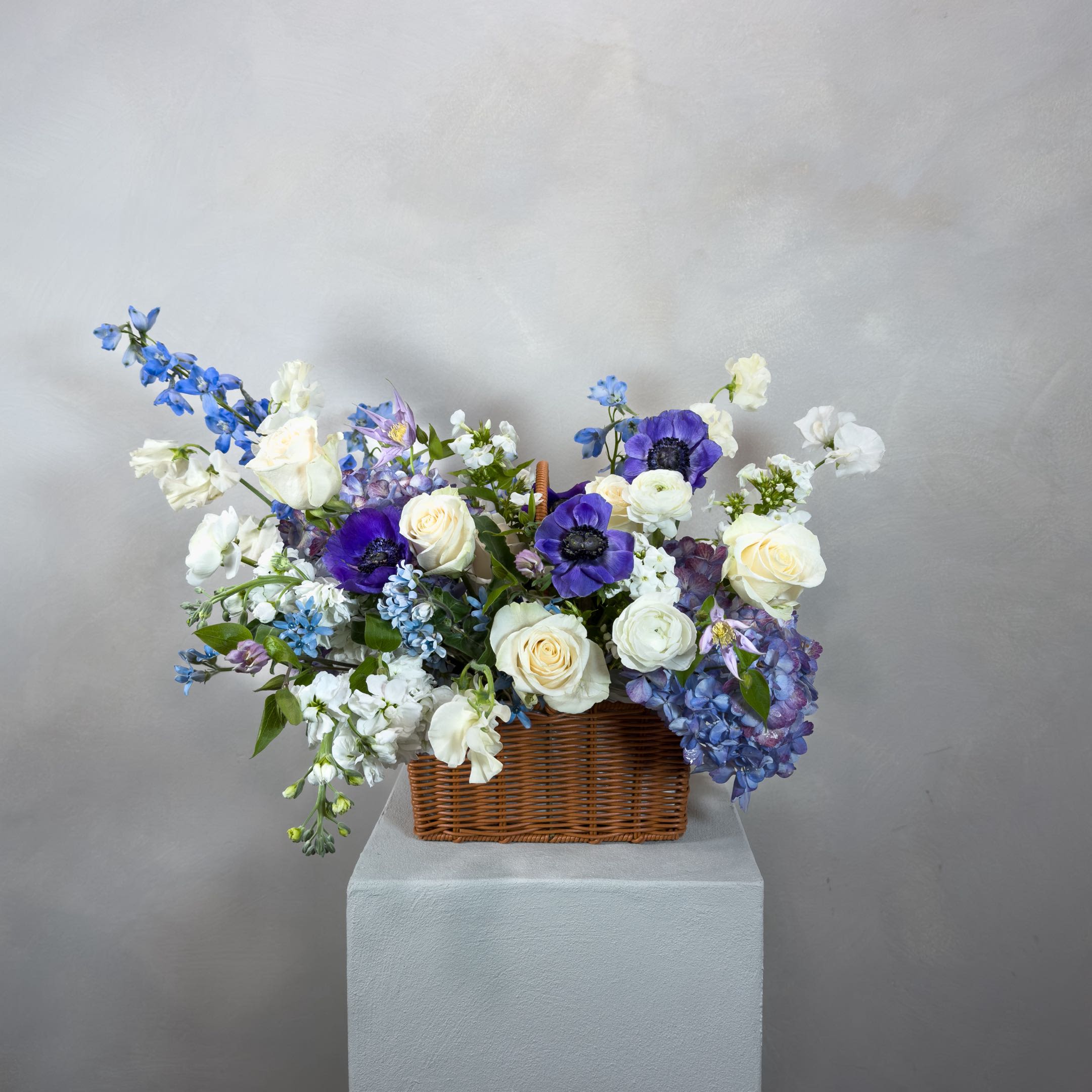 Raon Basket - Raon (라온) - a naturally composed arrangement presented in a woven basket.Designed with ease and movement, each piece is created using seasonal flowers, allowing color, texture, and form to come together intuitively.  No two arrangements are the same—each one is shaped with care, for a moment that feels thoughtful and bright.  What’s Included:  - Seasonal flowers, thoughtfully selected - Approximately 24 stems - Woven basket presentation - Handwritten note + care instructions  Please Note:  - Images are for inspiration only. - Each arrangement is one of a kind and not replicated.  Delivery:  - Next-day delivery is available and works well for most orders. - Orders are best placed 2–3 days in advance. - For same-day or weekend delivery, call or text 704.975.2774 to confirm availability.  FINAL SALE POLICY: All orders are final sale. Due to the custom and perishable nature of our floral designs, we are unable to accommodate cancellations, refunds, or exchanges once an order has been placed. Each arrangement is made uniquely for you, with care and attention to detail.