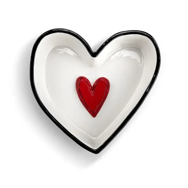 Heart-shaped white dish with a red heart in the center