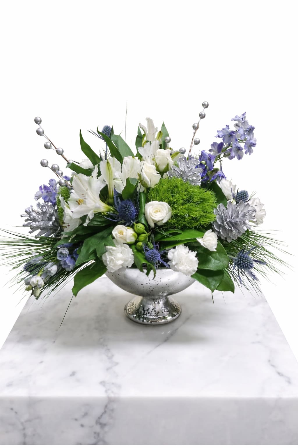 Hanukkah Sameach! - Beautifully designed mercury silver bowl with stunning blue accents. Inspired by winter’s cool blue &amp; white colors, our delightful arrangement delivers warm wishes to the people you love.