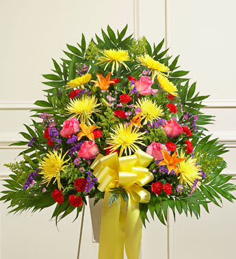 PRIMAVERAL BASKET - Product ID: 91389   During times of great sorrow, a message of care and hope is always important and appreciated. Our expert florists create this exquisite standing basket, filled with a colorful array of roses, lilies, mums and more, for a touching tribute thatâs appropriate for family, friends, or coworkers, letting them know that brighter days are ahead. Standing basket arrangement of fresh, brightly colored roses, lilies, mums, mini carnations, statice and more Appropriate for family, friends or business associates to send directly to the funeral home Our florists use only the freshest flowers available, so colors and varieties may vary Large measures approximately 38"H x 38"L without stand Medium measures approximately 32"H x 36"L without stand Small measures approximately 30"H x 34"L without stand Stand may not be available in all areas