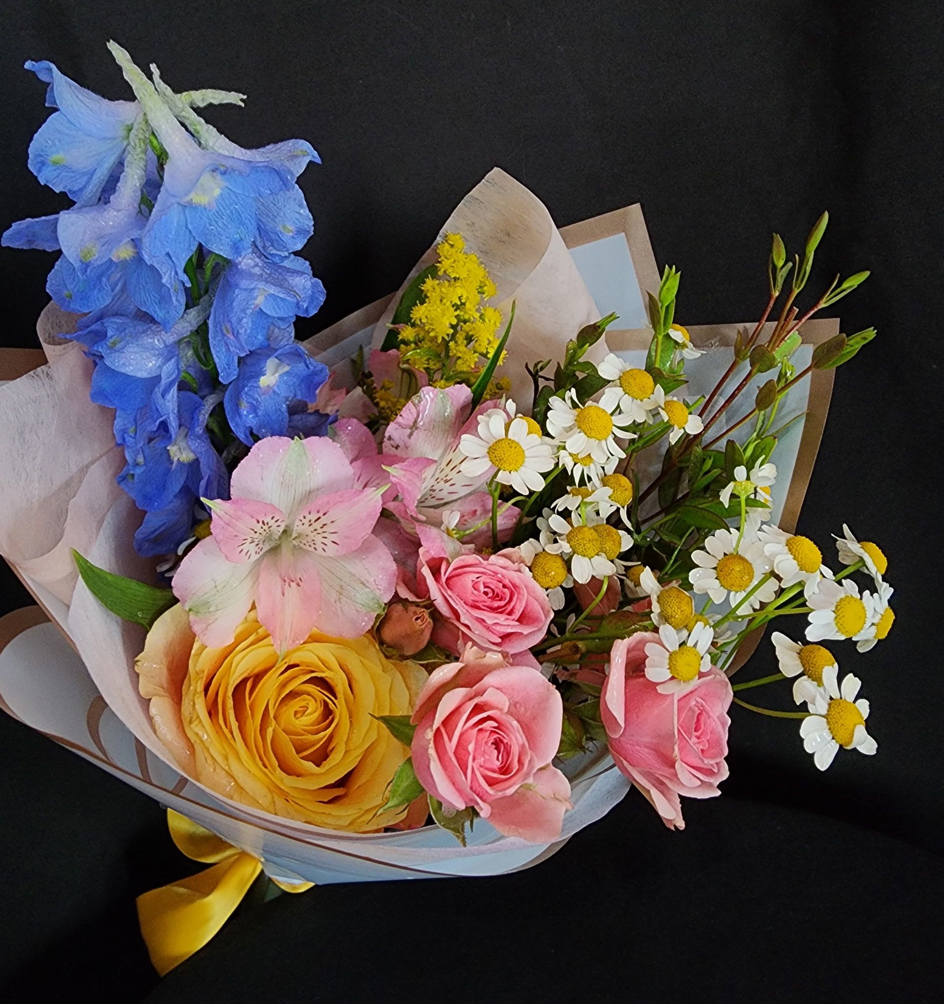 Mini Special Bouquet  - When you have enough vases at home....send a wrapped bouquet of seasonal flowers.  These bouquets are smaller versions of our special bouquets.  Standard bouquet dimensions are approximately 18" height x 10" diameter. Deluxe bouquet dimensions are approximately 18" height x 12" diameter. Premium bouquet dimensions are approximately 19" height x 13" diameter.  Photos represent an example of what these bouquets could look like. Please call or write in notes if you have specific flowers or colors in mind.
