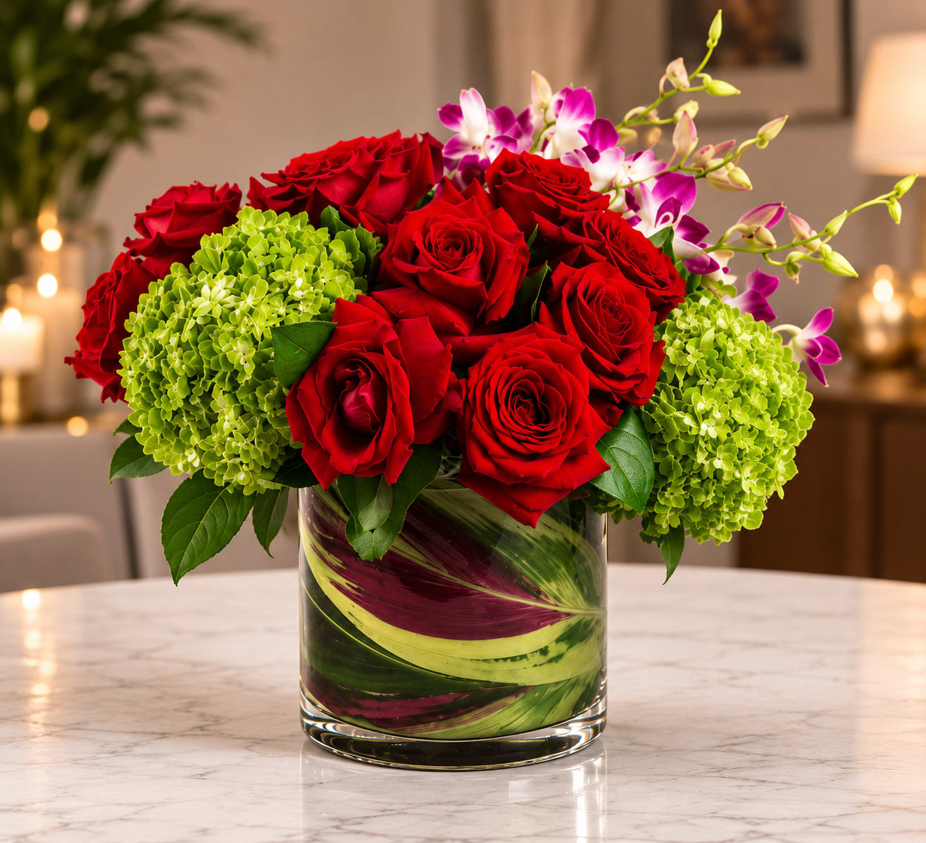 Ruby Luxe - A celebration of luxury and life, this large and jewel toned arrangement is enough to stop anybody in their tracks. Roses, orchids and hydrangeas come together in this purely floral masterpiece.    APPROXIMATE DIMENSIONS are 12"D X 12"H