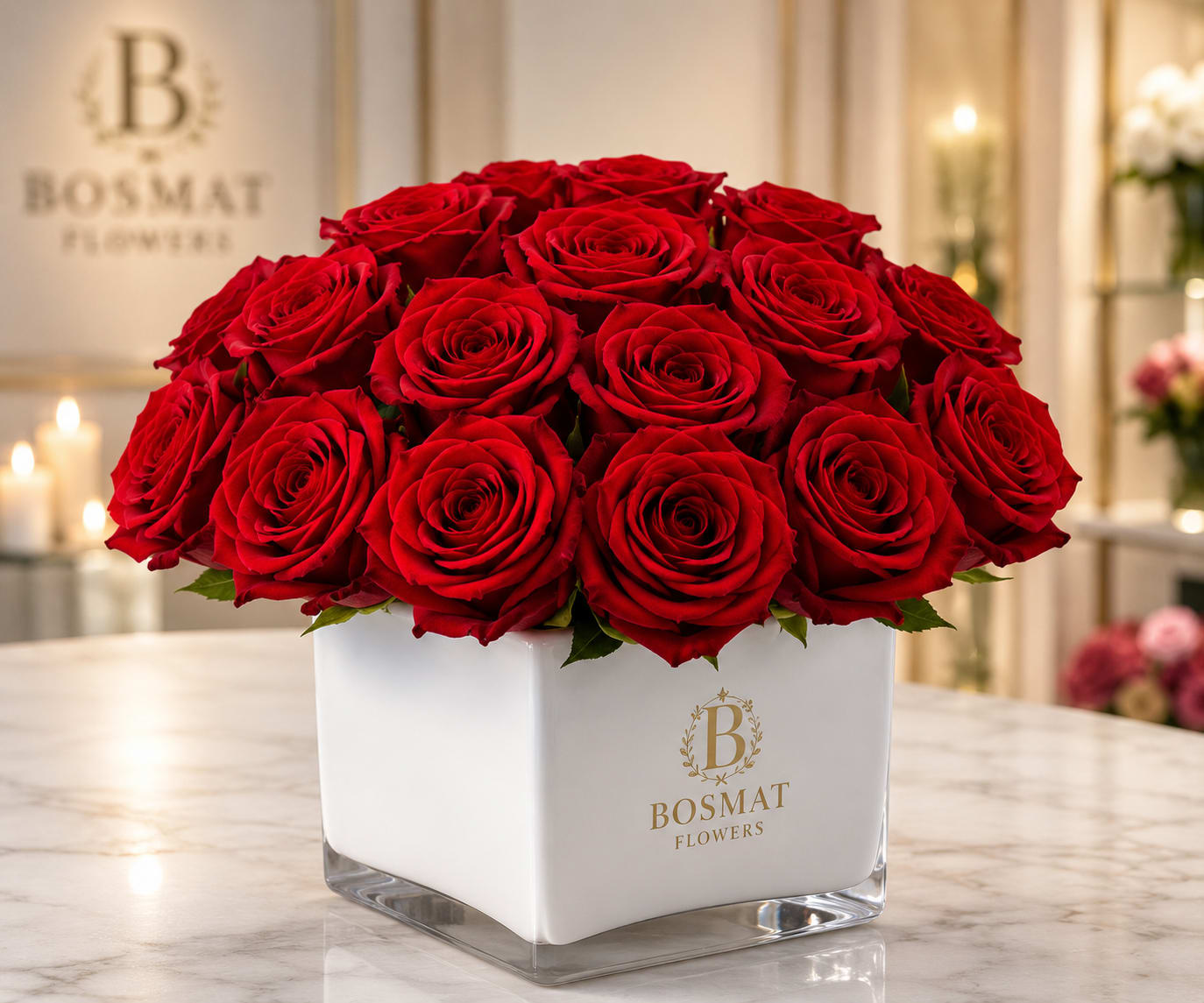 Classic Elegance Rose Cube - Embrace the essence of boldness and elegance with our exquisite bouquet, Radiant in Red by Bosmat Flowers. Perfectly sized for any desk, this captivating arrangement is designed to make a lasting impression.  The bouquet showcases a stunning collection of vibrant red blooms, radiating passion and love. Each carefully selected flower exudes beauty and charm, capturing the essence of heartfelt emotions. Whether it's Valentine's Day, a birthday, or an anniversary, Radiant in Red is a captivating gift choice that conveys your deepest affections.  Imagine the joy and excitement that will fill the recipient's heart as they receive this dazzling arrangement. The harmonious combination of rich red flowers creates an atmosphere of romance and admiration, making it a truly memorable gift.  Radiant in Red is crafted with meticulous attention to detail, ensuring that each stem is placed with care and precision. The tasteful arrangement strikes the perfect balance between boldness and refinement, making it an ideal choice for any occasion that calls for an expression of love and celebration.  Let Radiant in Red by Bosmat Flowers be the embodiment of your sentiments, a gift that will ignite passion, celebrate milestones, and create cherished memories that will last a lifetime. 