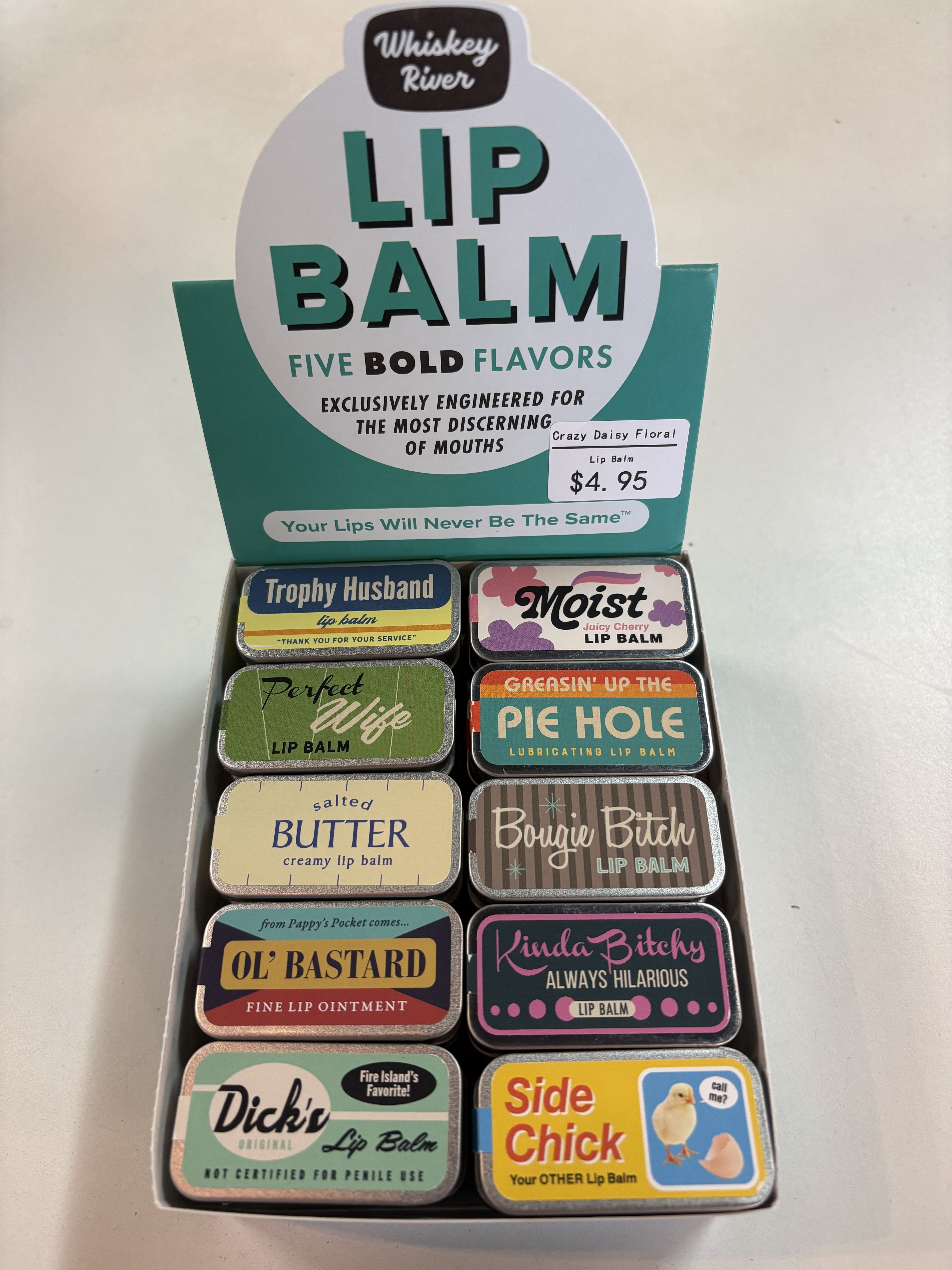 Whiskey River Lip Balm - Made-in-USA lip balm tins. 5 different flavors: vanilla, mint, blue raspberry, cherry, and original.