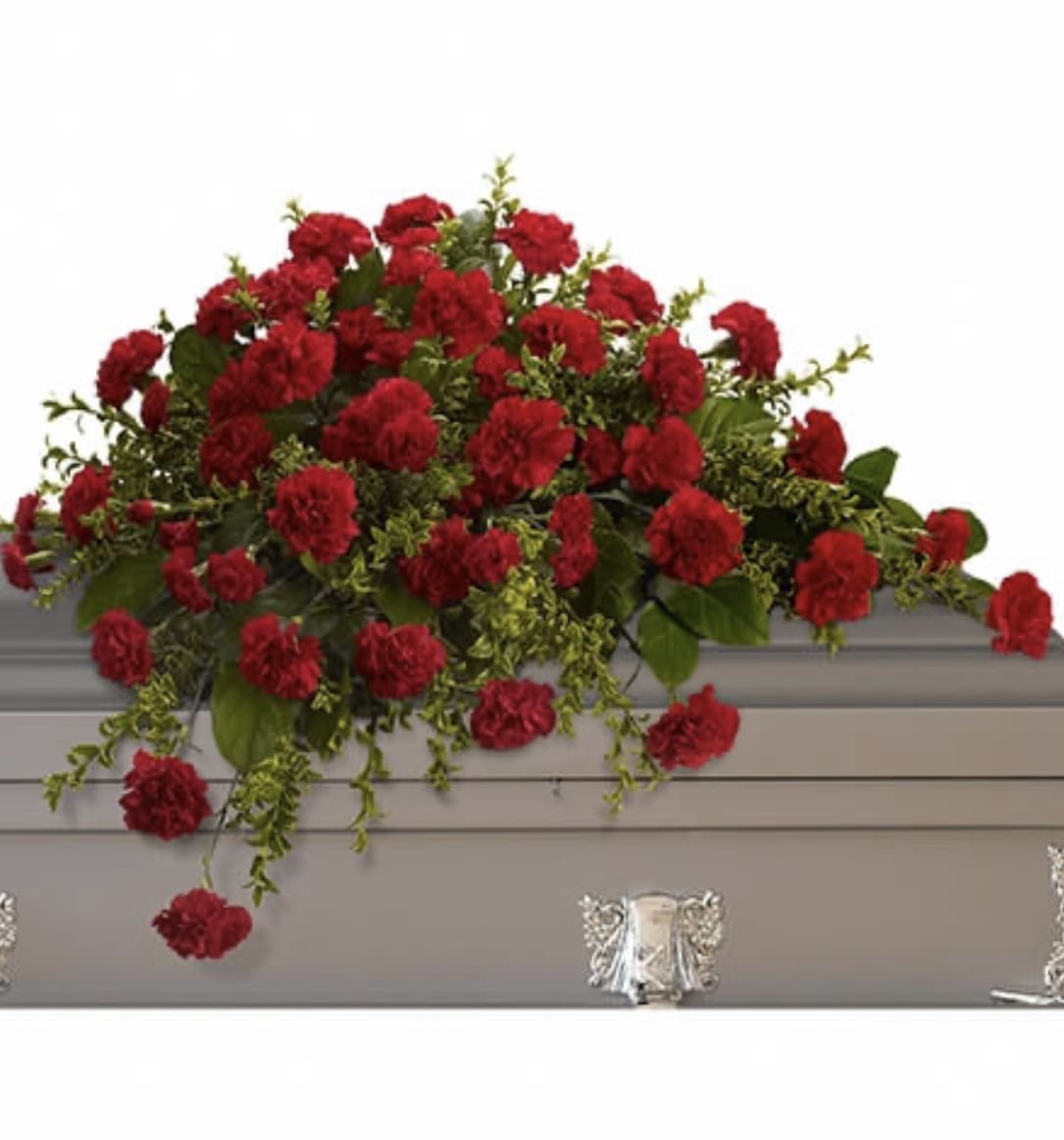 Long red carnation casket spray arranged atop a gray casket