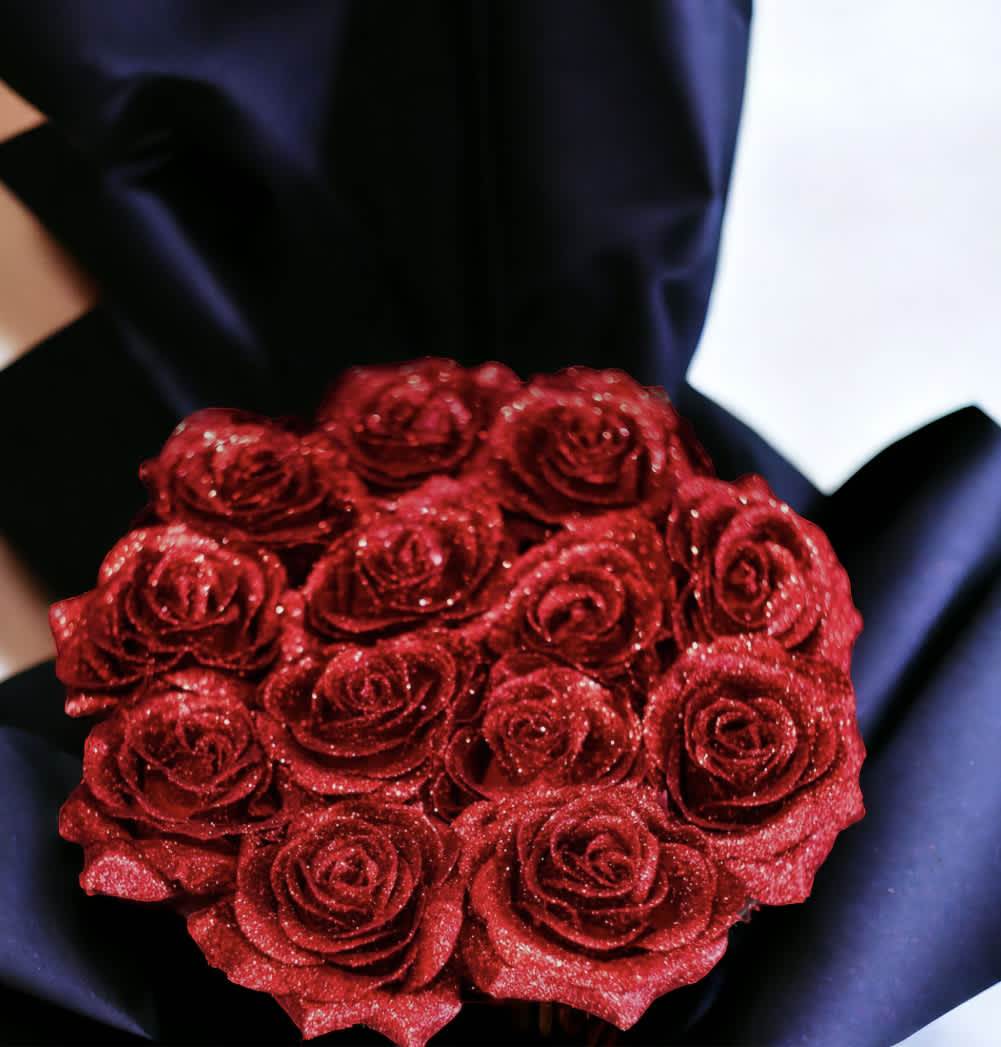 Round bouquet of glittery red roses wrapped in black paper