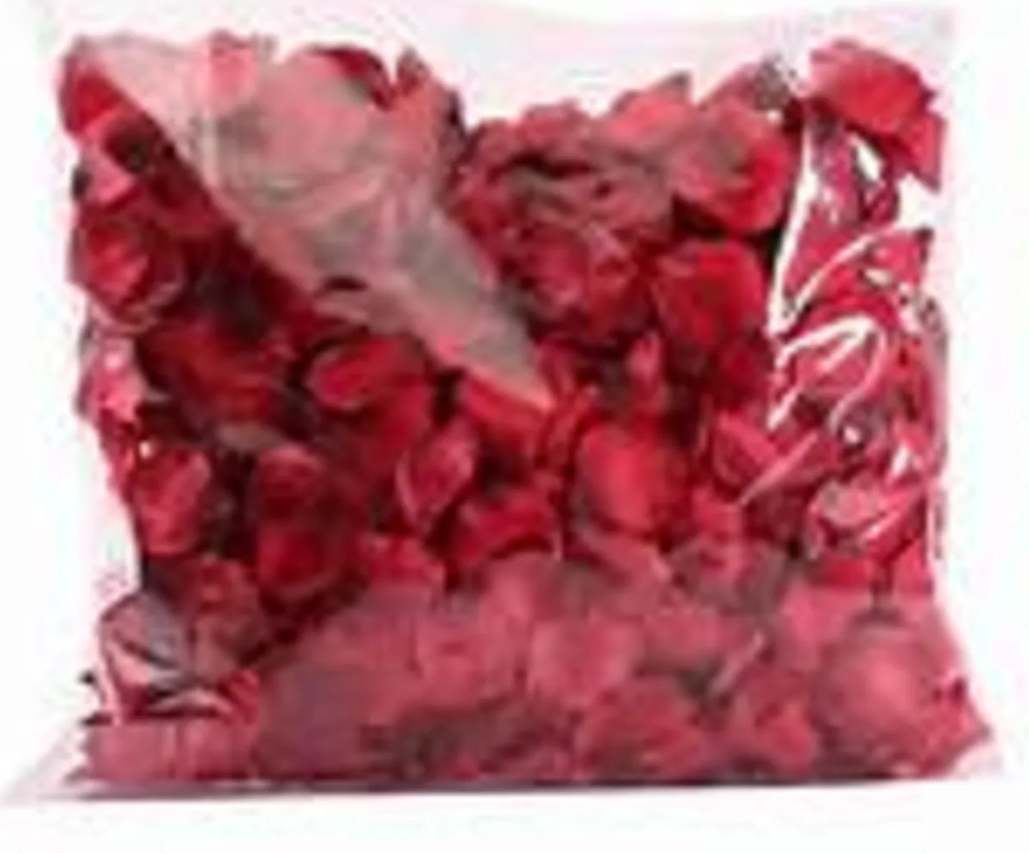 Clear plastic bag filled with loose red rose petals