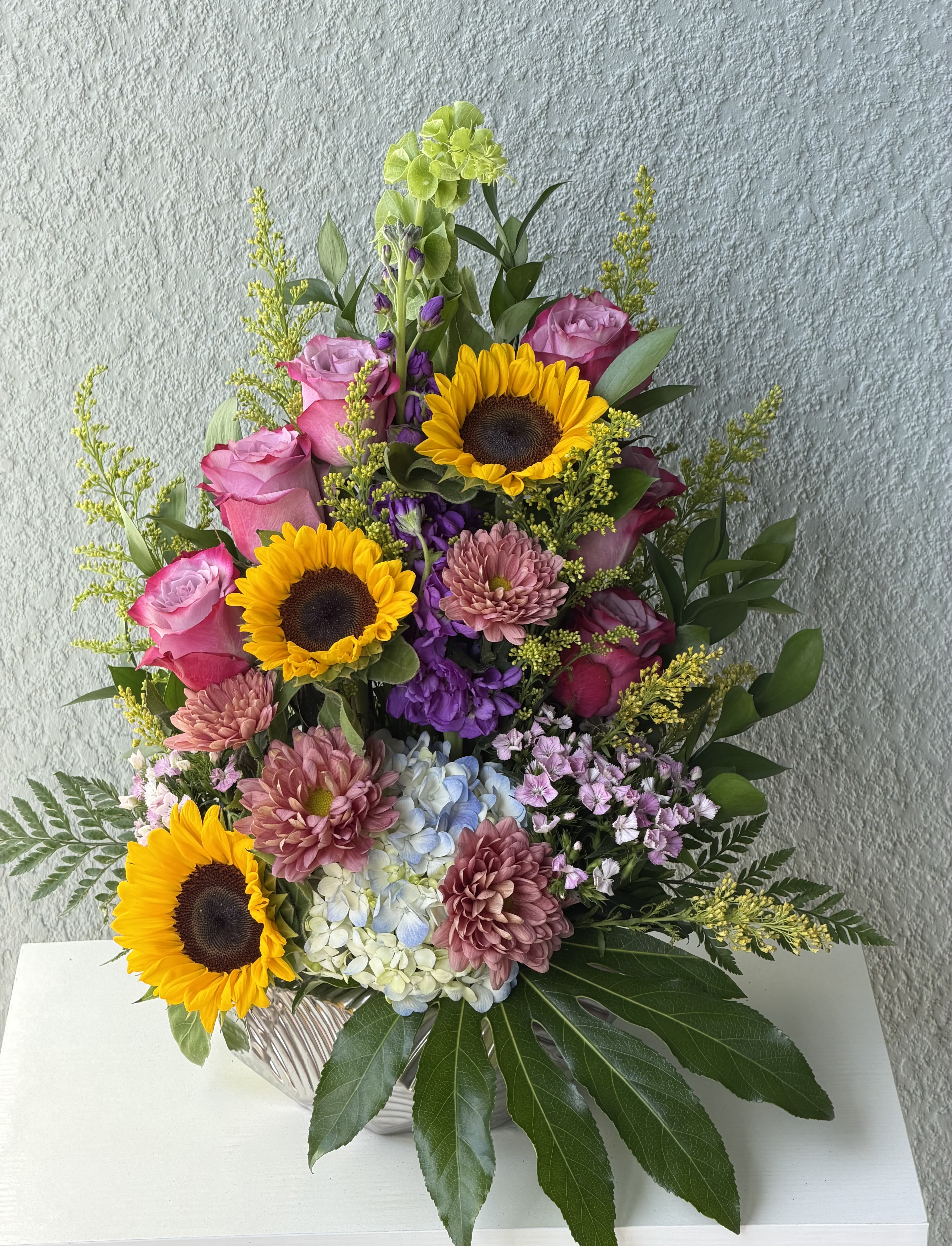 Summer vibes  - Sunflower brightness meets garden-fresh romance in this cheerful summer bouquet-perfect as a birthday bouquet, thank-you gift, or a pick-me-up for someone who loves vivid color. 